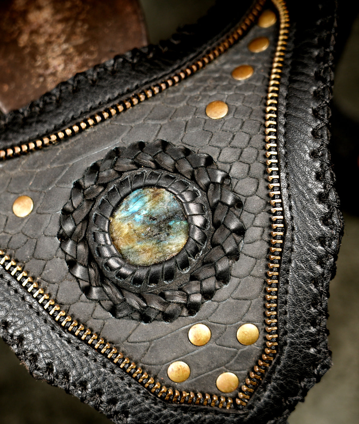 Avant-garde leather shoulder holster with multi-pocket storage, crafted for alternative style and music festivals
