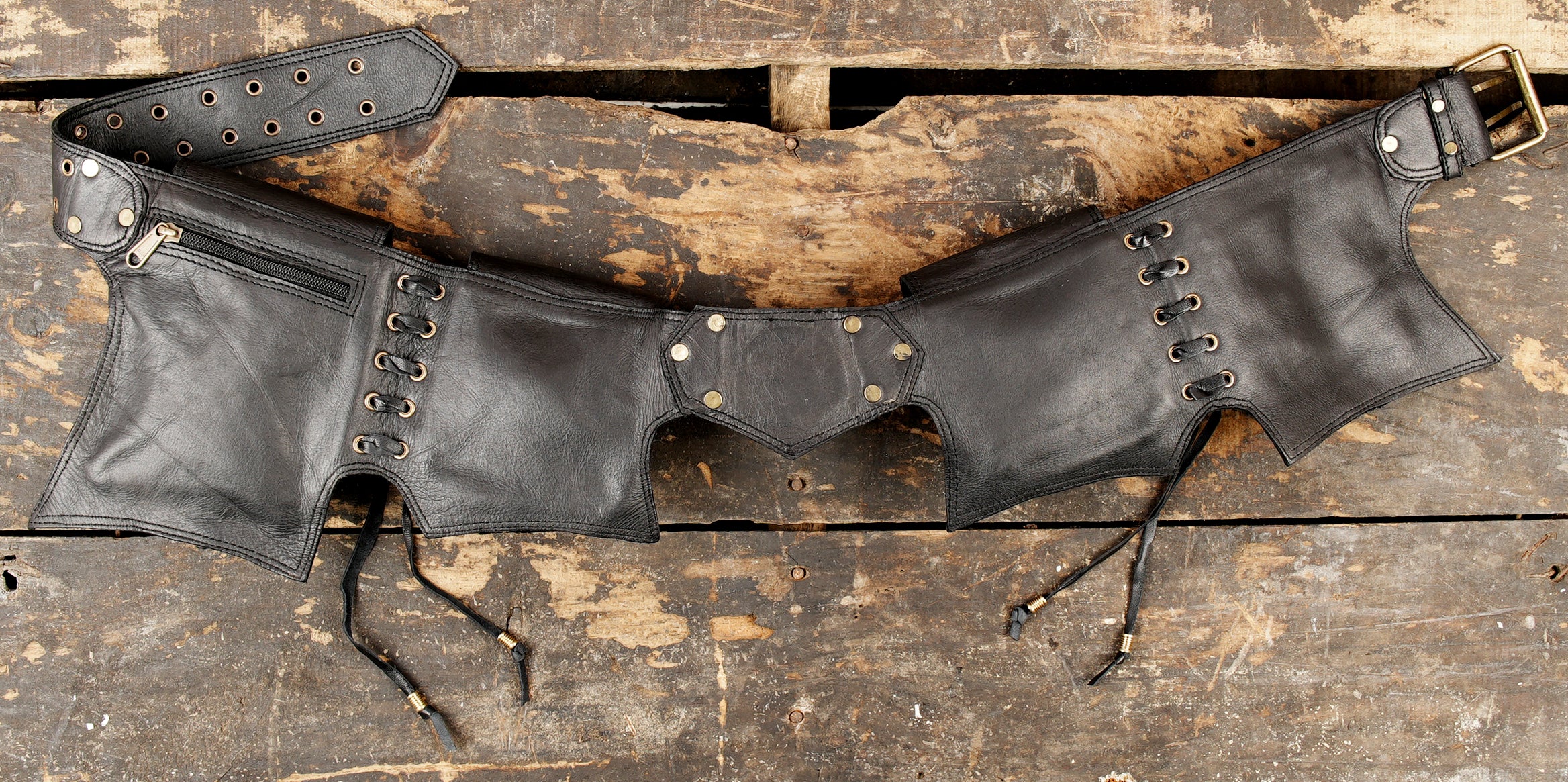 Post-apocalyptic style black leather hip belt with functional storage pouches and brass rivets.