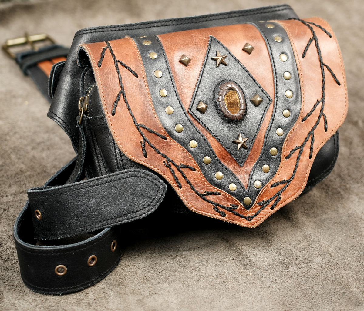 Two-tone leather fanny pack with braided stitch detailing