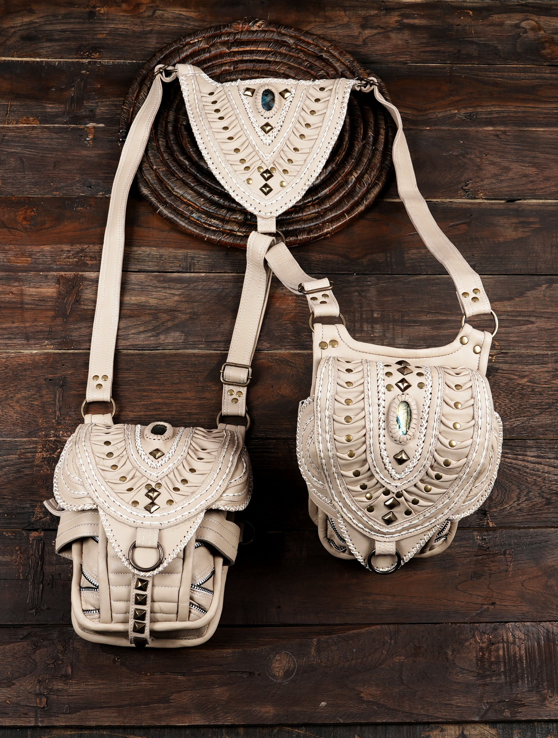 Functional dual pocket cream leather shoulder holster bag with secure zippered compartments.