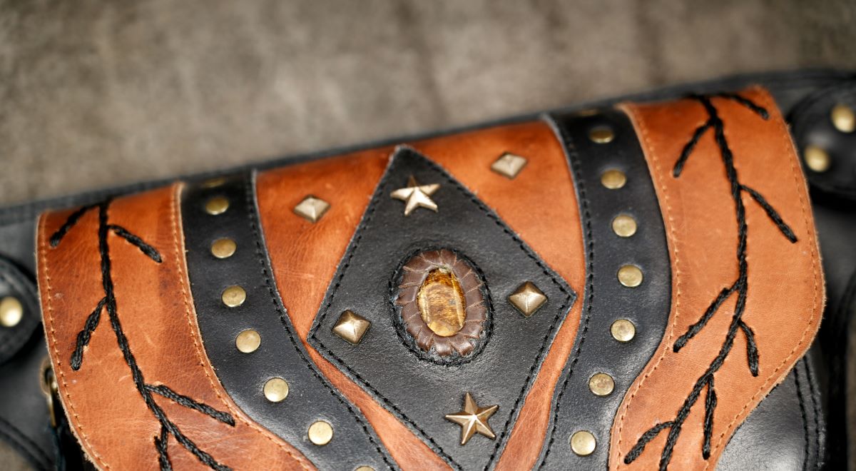 Leather hip pouch featuring genuine tiger eye stone centerpiece