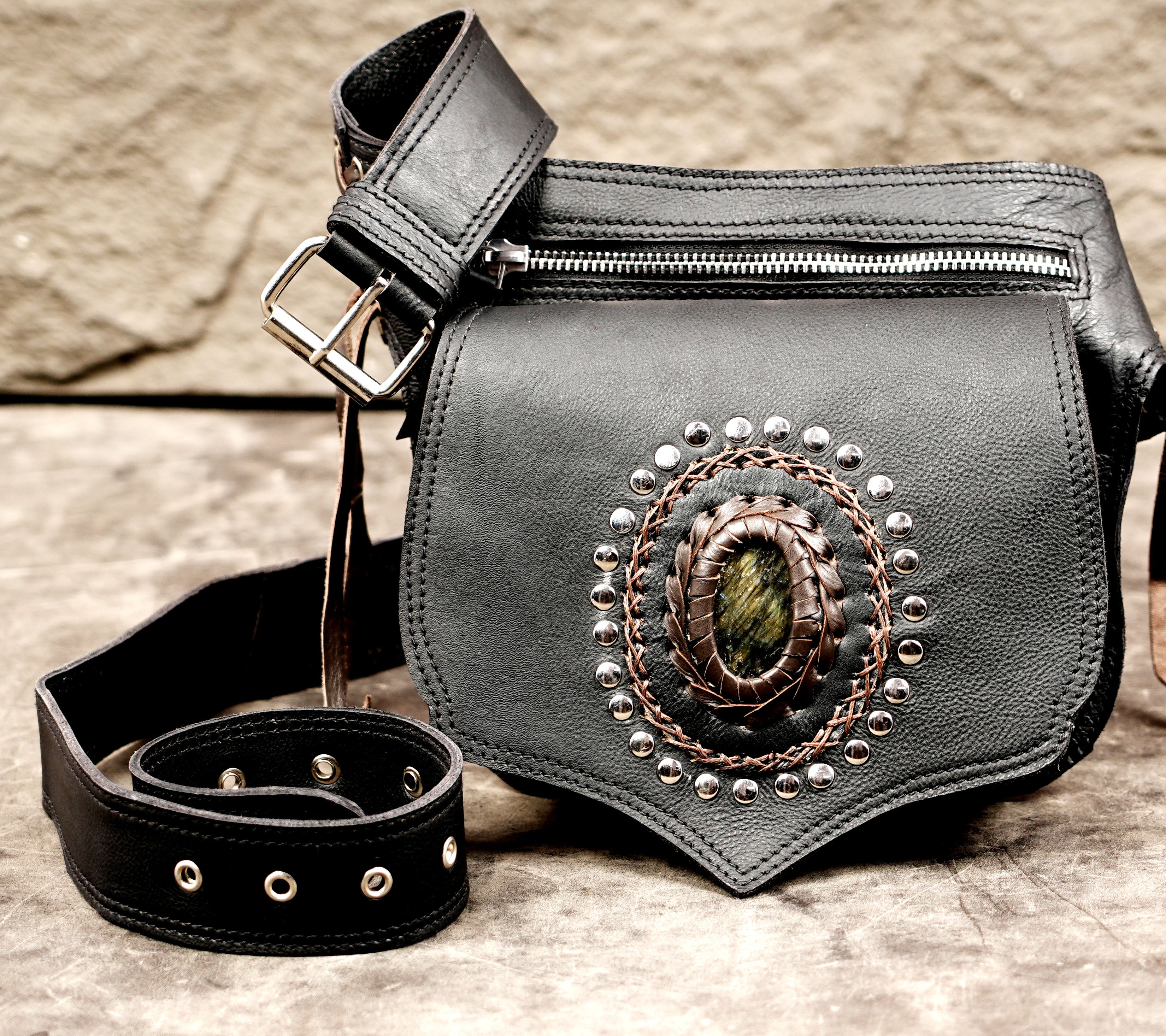 Steampunk black leather utility belt pouch with corset-style lacing and silver hardware.