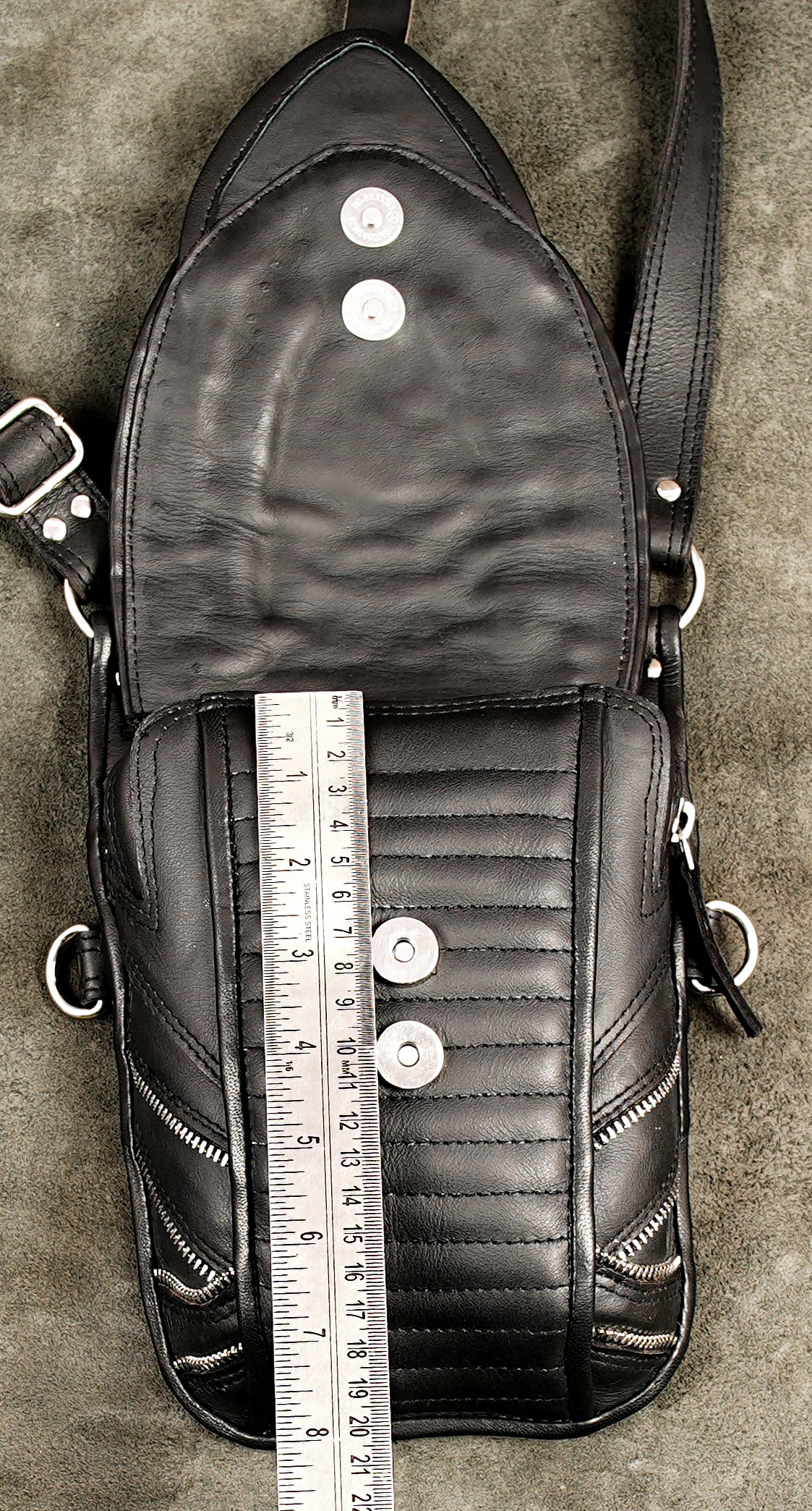 Black leather multi pouch festival harness featuring silver hardware and rivets