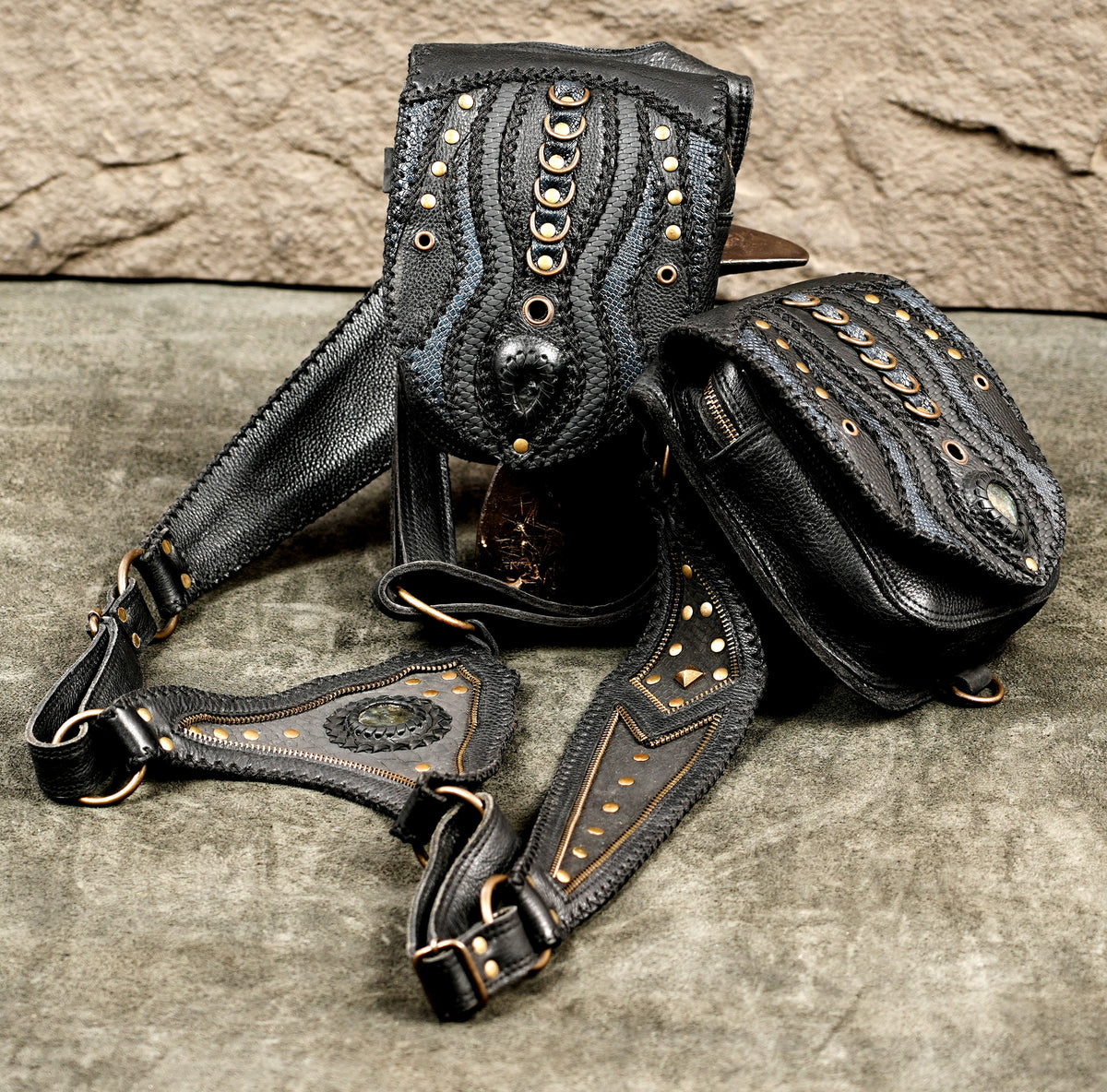 Boho-chic leather harness bag with twin holster pockets, blending artisan craftsmanship with edgy apparel
