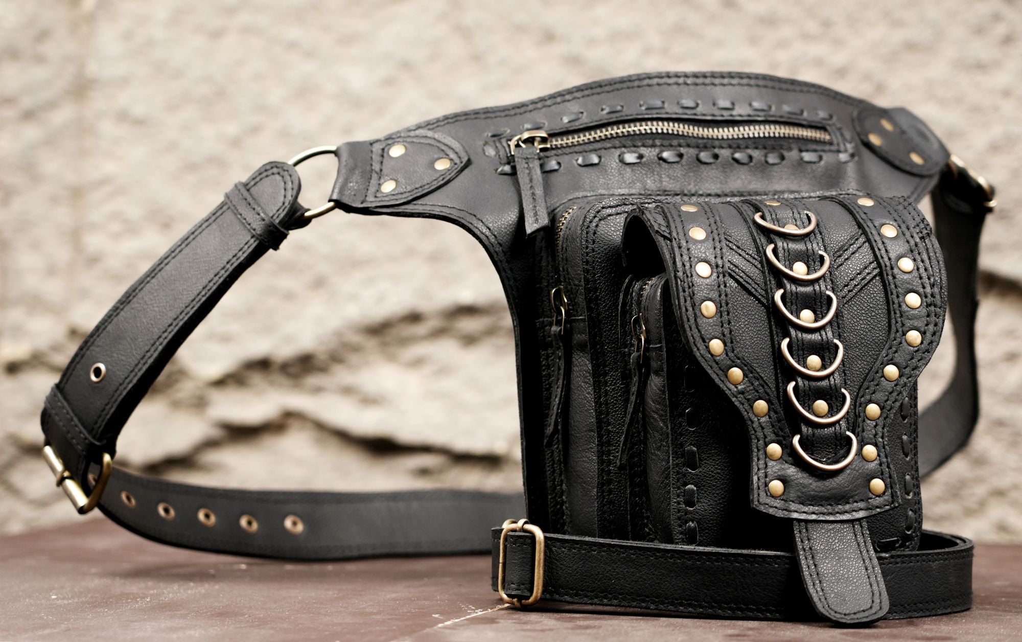 Black leather utility thigh belt with metal rings and studs