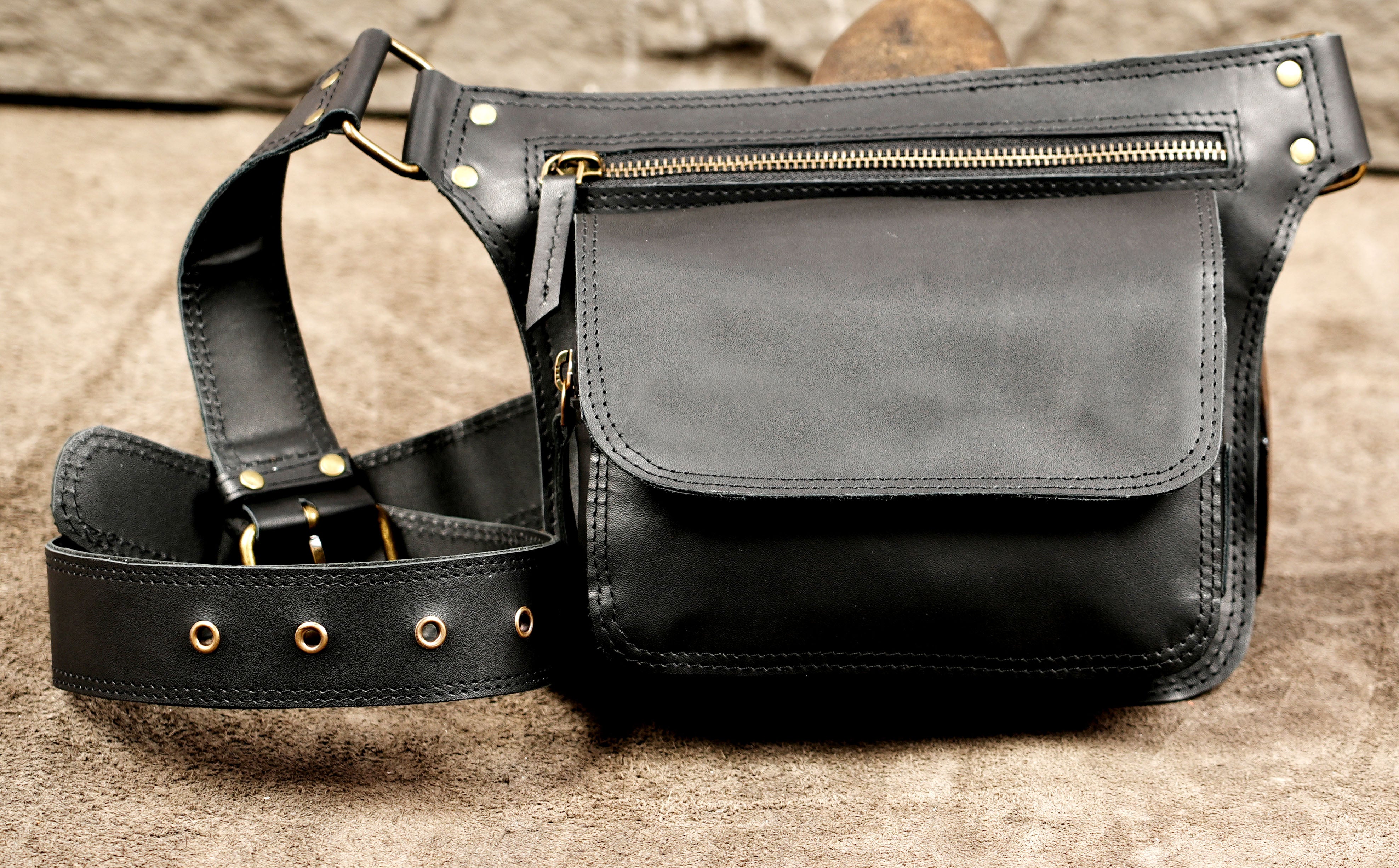 Adjustable leather crossbody bag worn at the hip