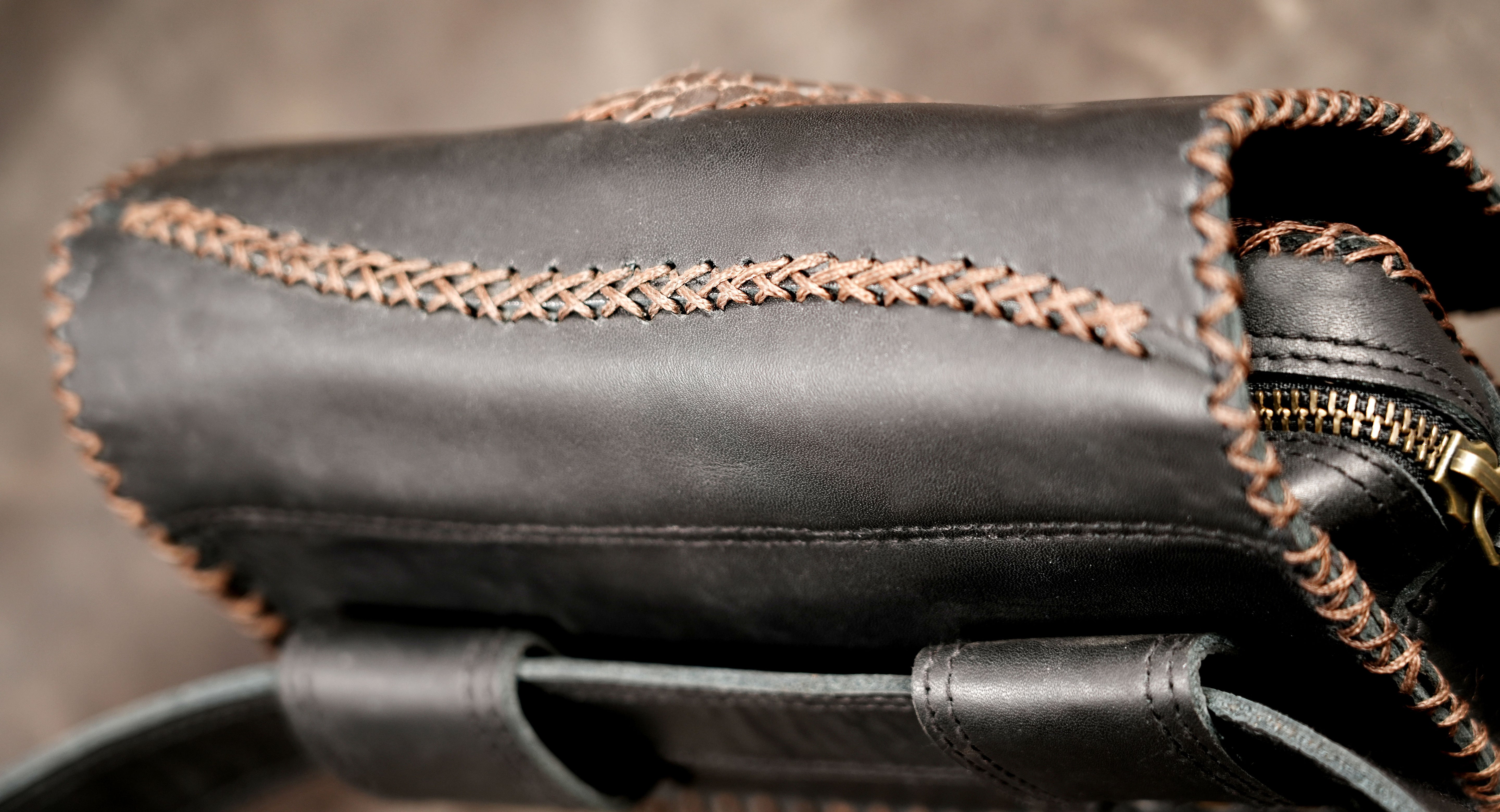 Black leather fanny pack with antique brass hardware