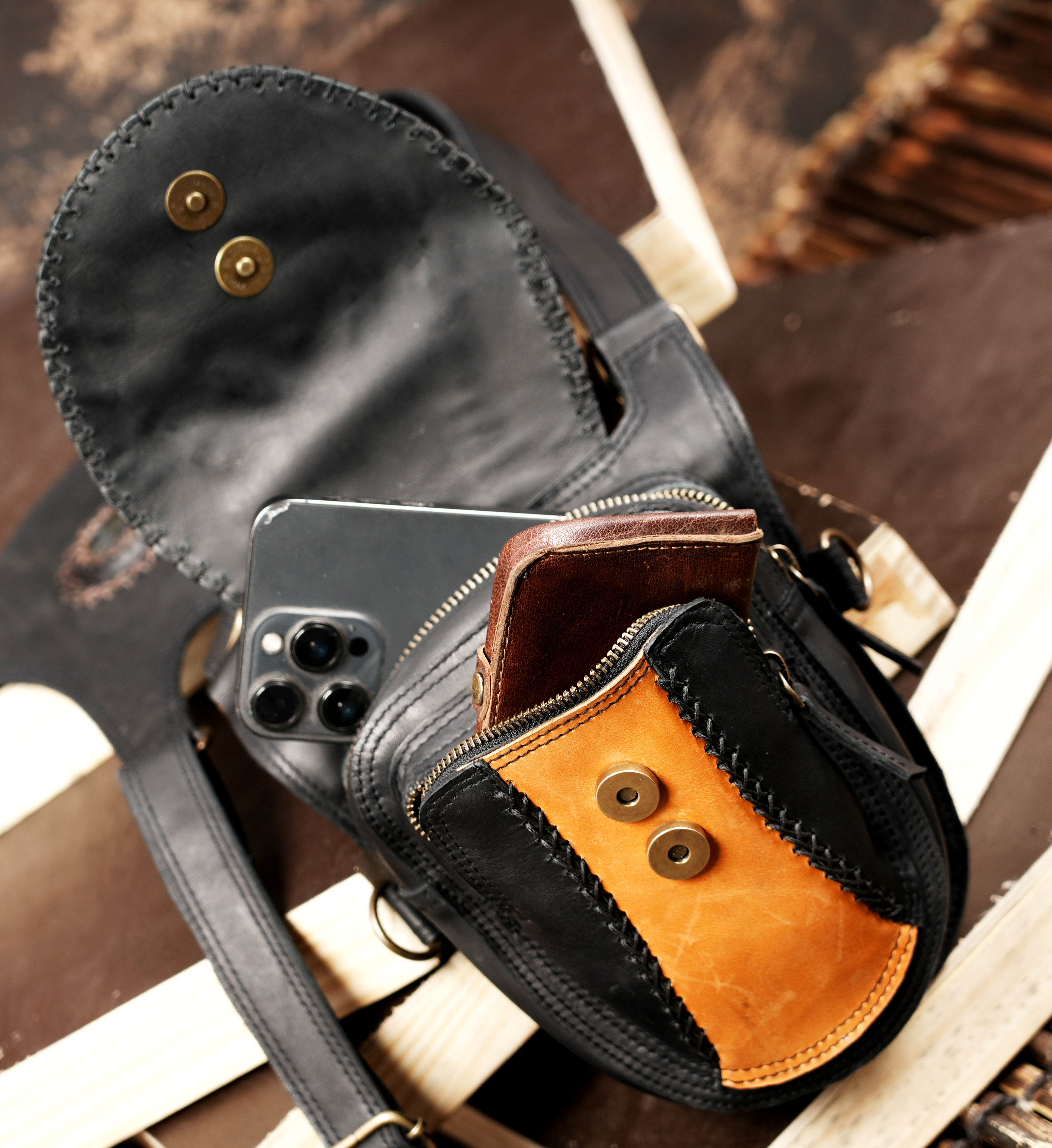 Black leather holster with tan stitched front design
