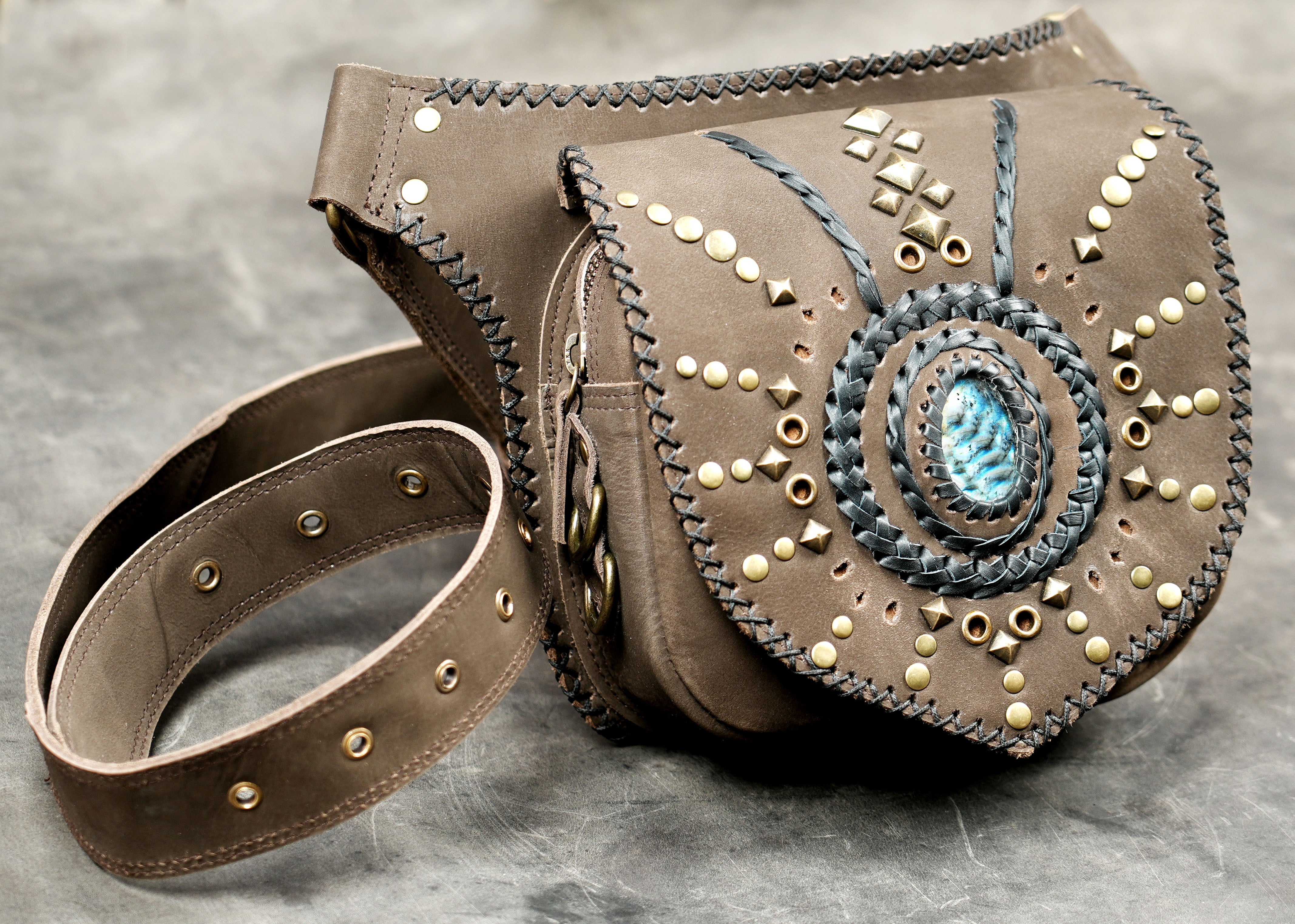 Adjustable brown leather belt bag with brass stud accents