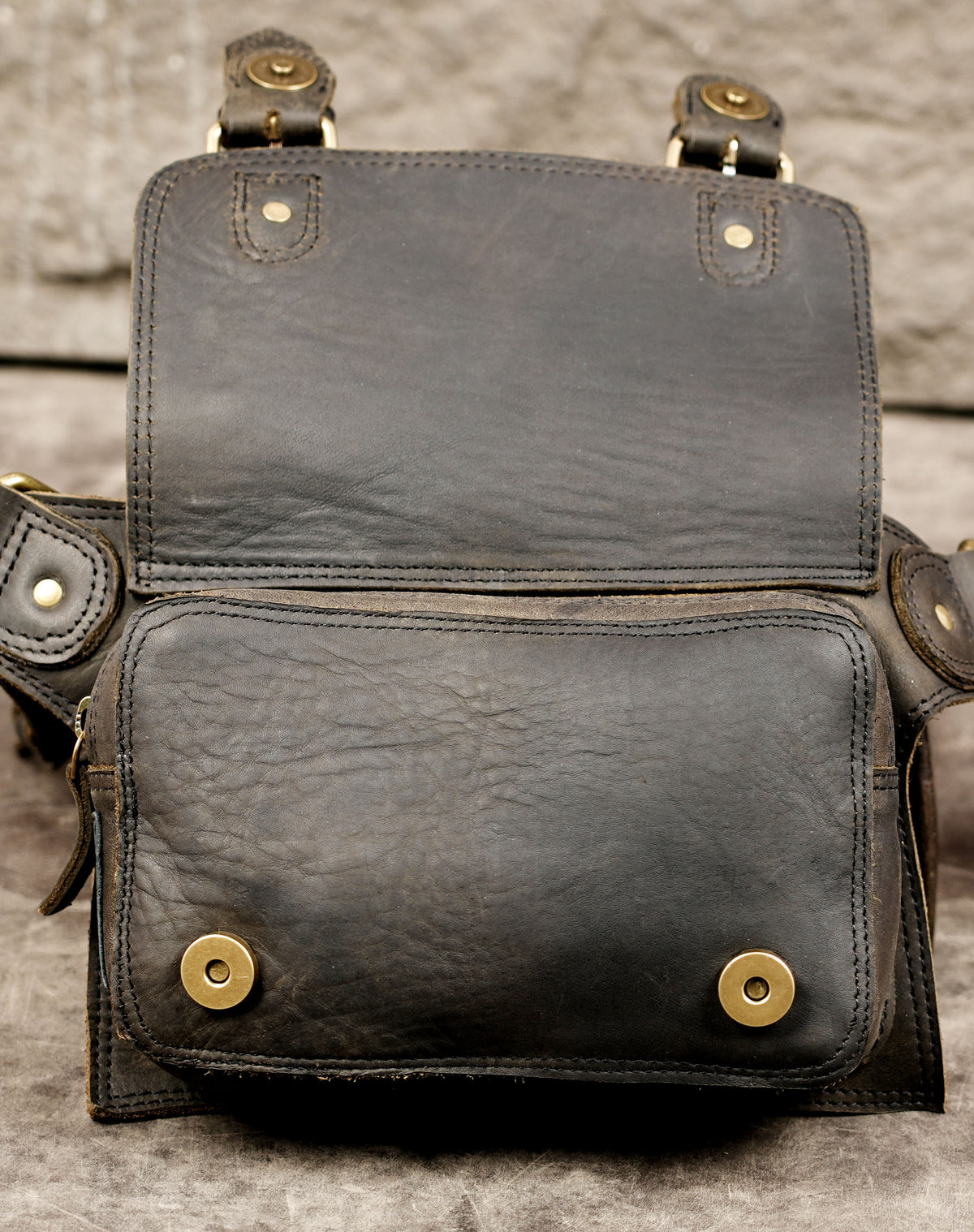 Handmade leather utility strap with antique brass fittings