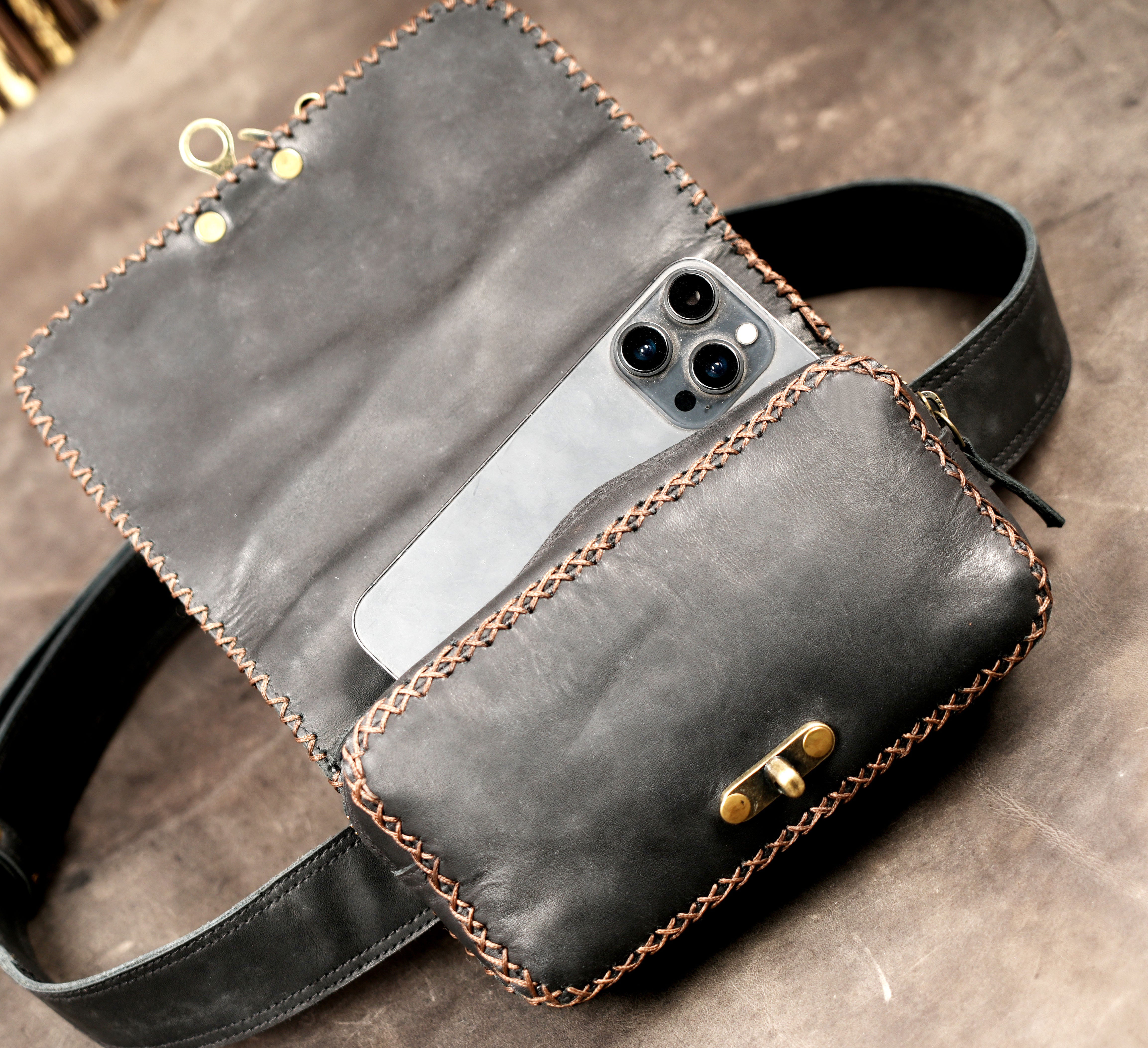 Handcrafted leather belt purse with decorative stitching