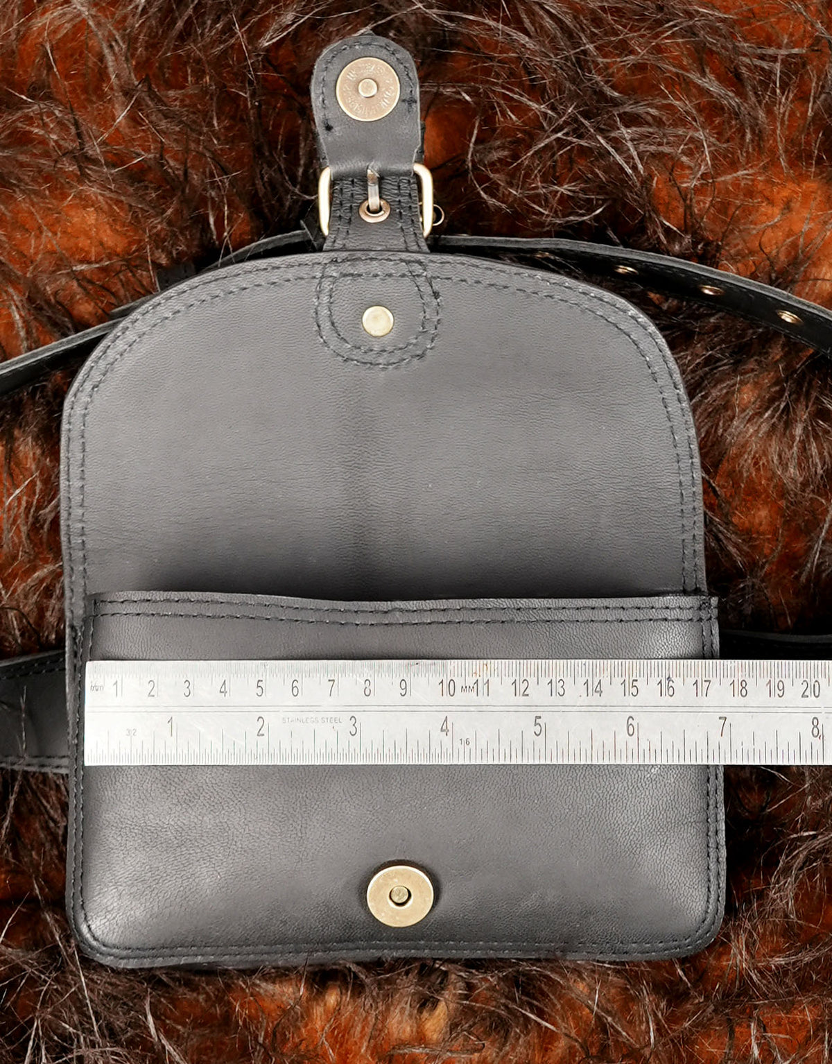 Chic black leather hip bag designed for modern streetwear   