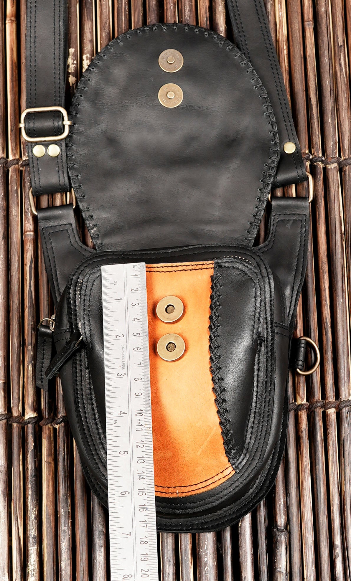 Travel ready leather holster with front zip bags