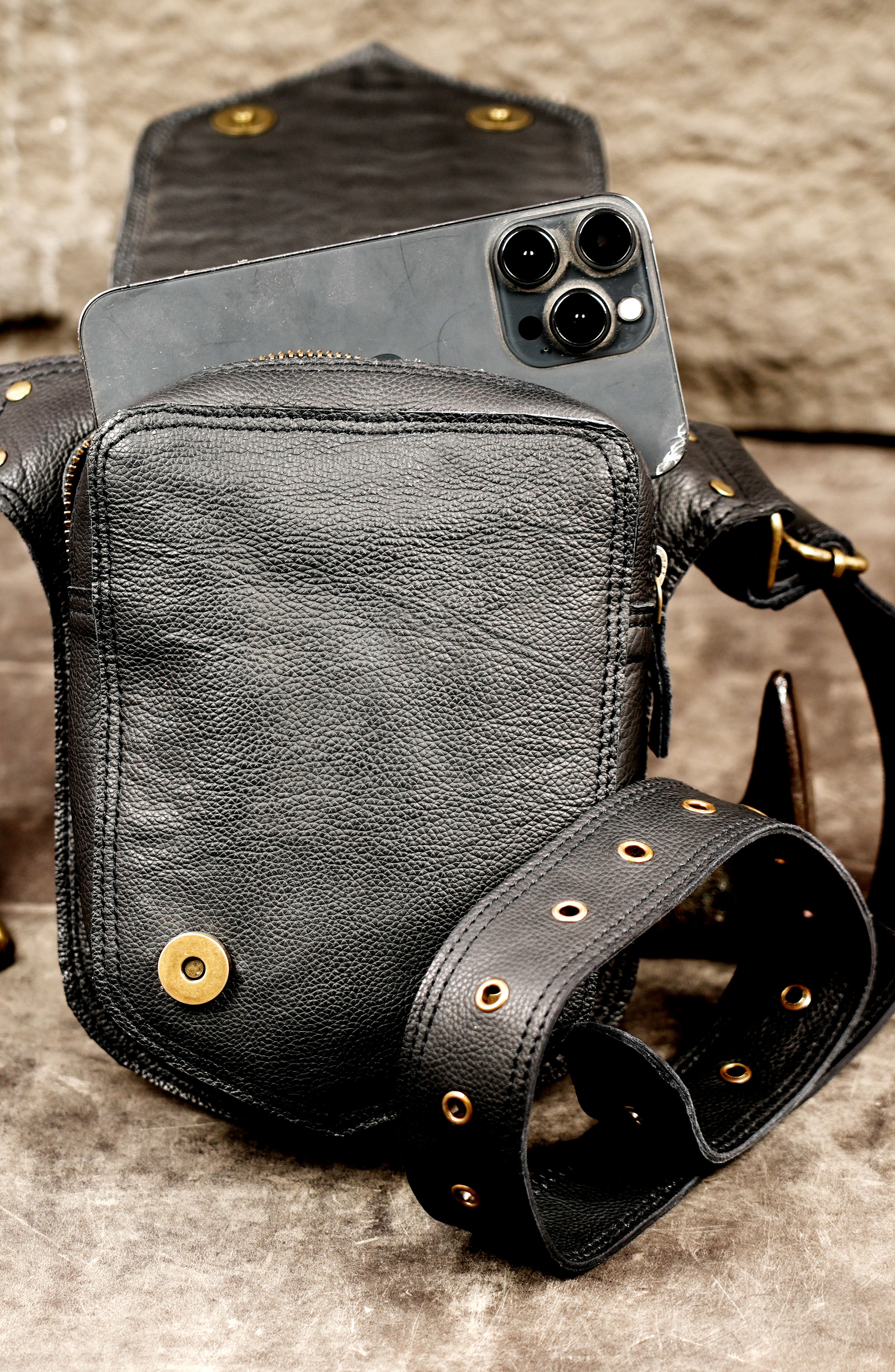Black leather waist cincher with studded design
