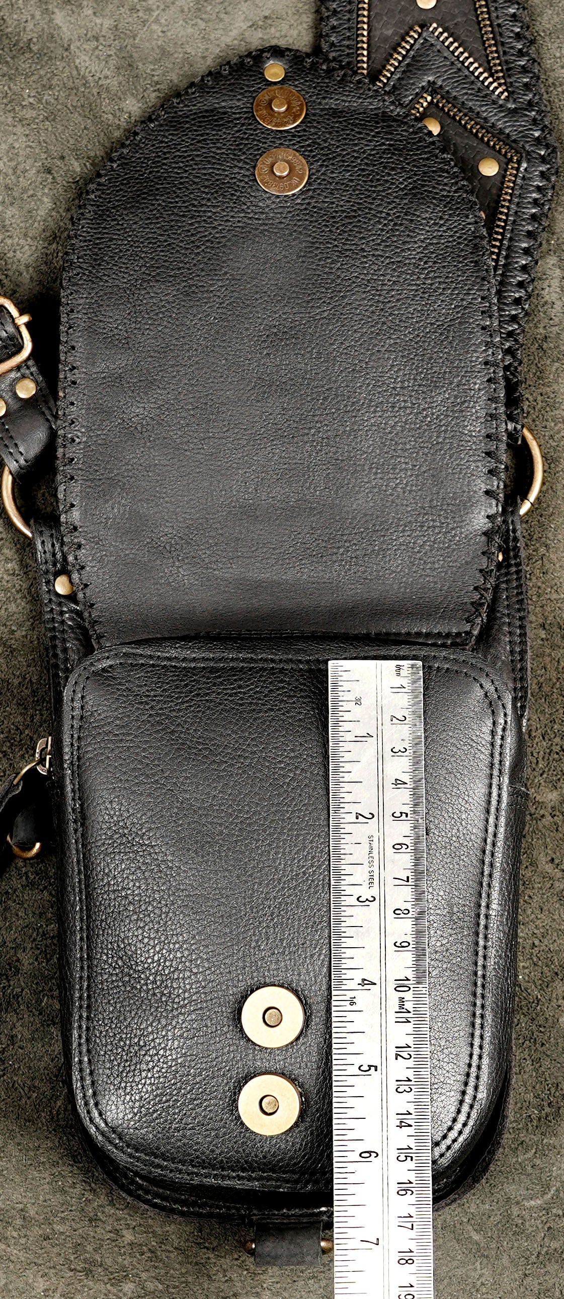 Artisan-made black leather holster bag with double side compartments and decorative metallic accents