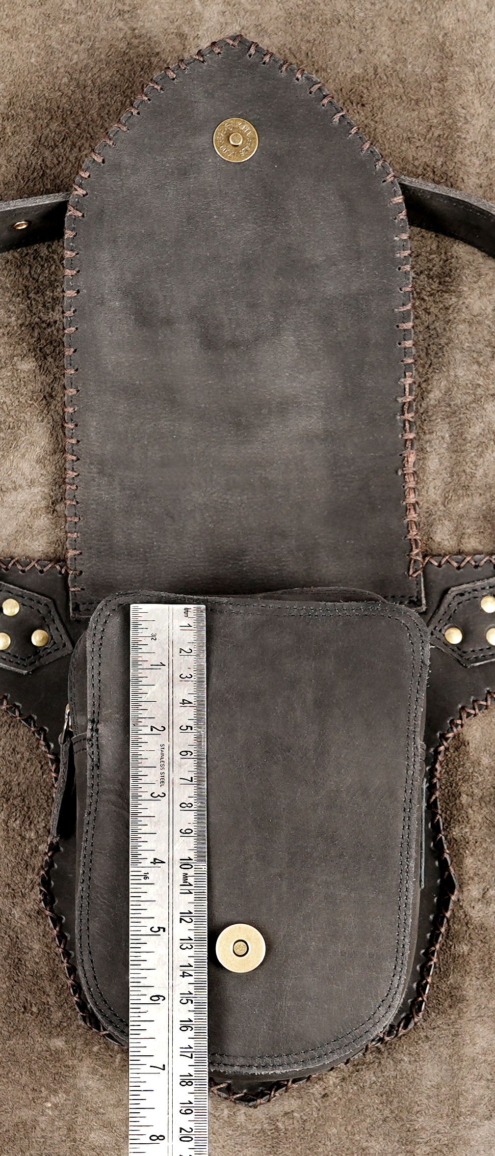 Handmade leather waist pouch with decorative stone and stud details