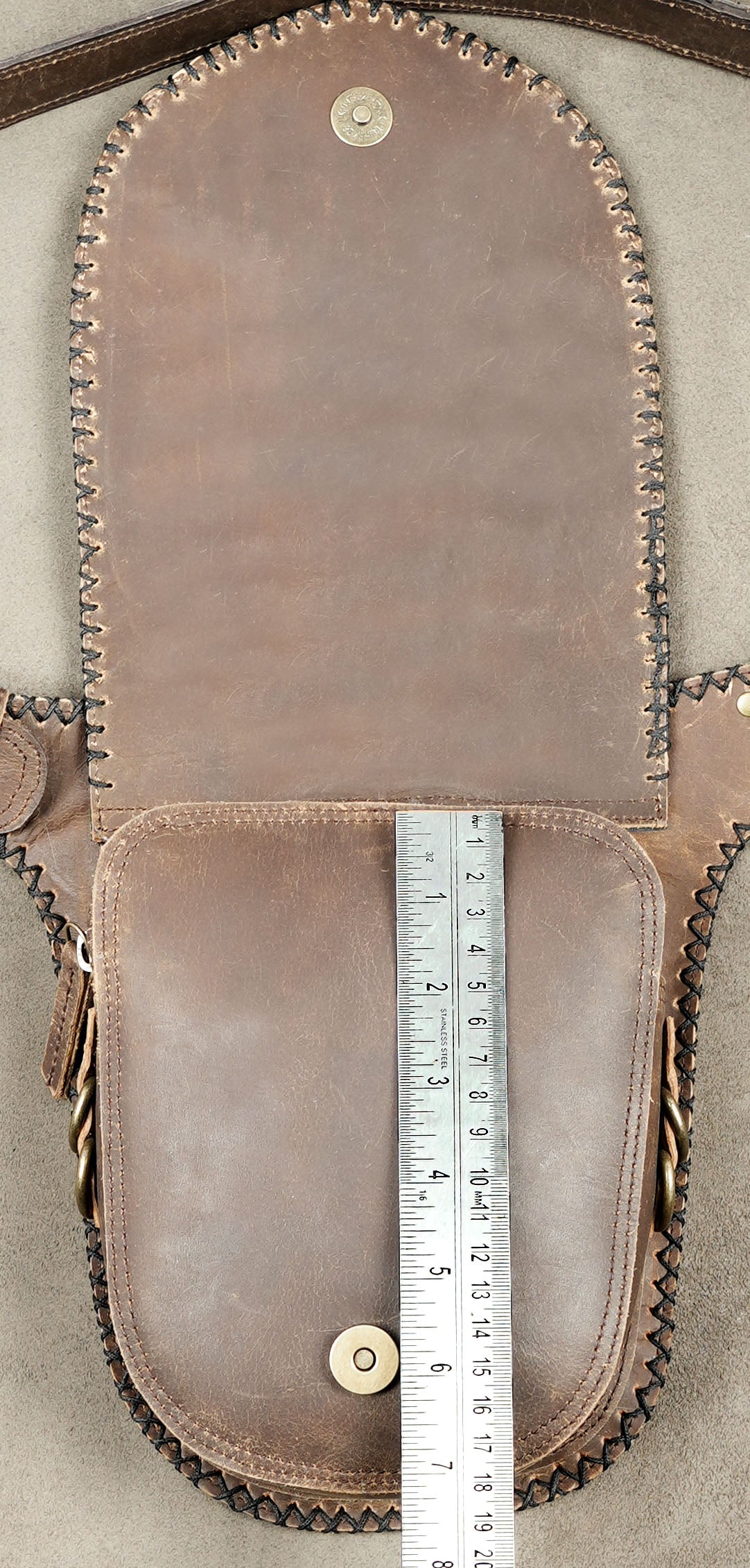 Handmade leather utility belt bag with secure zipper compartments.