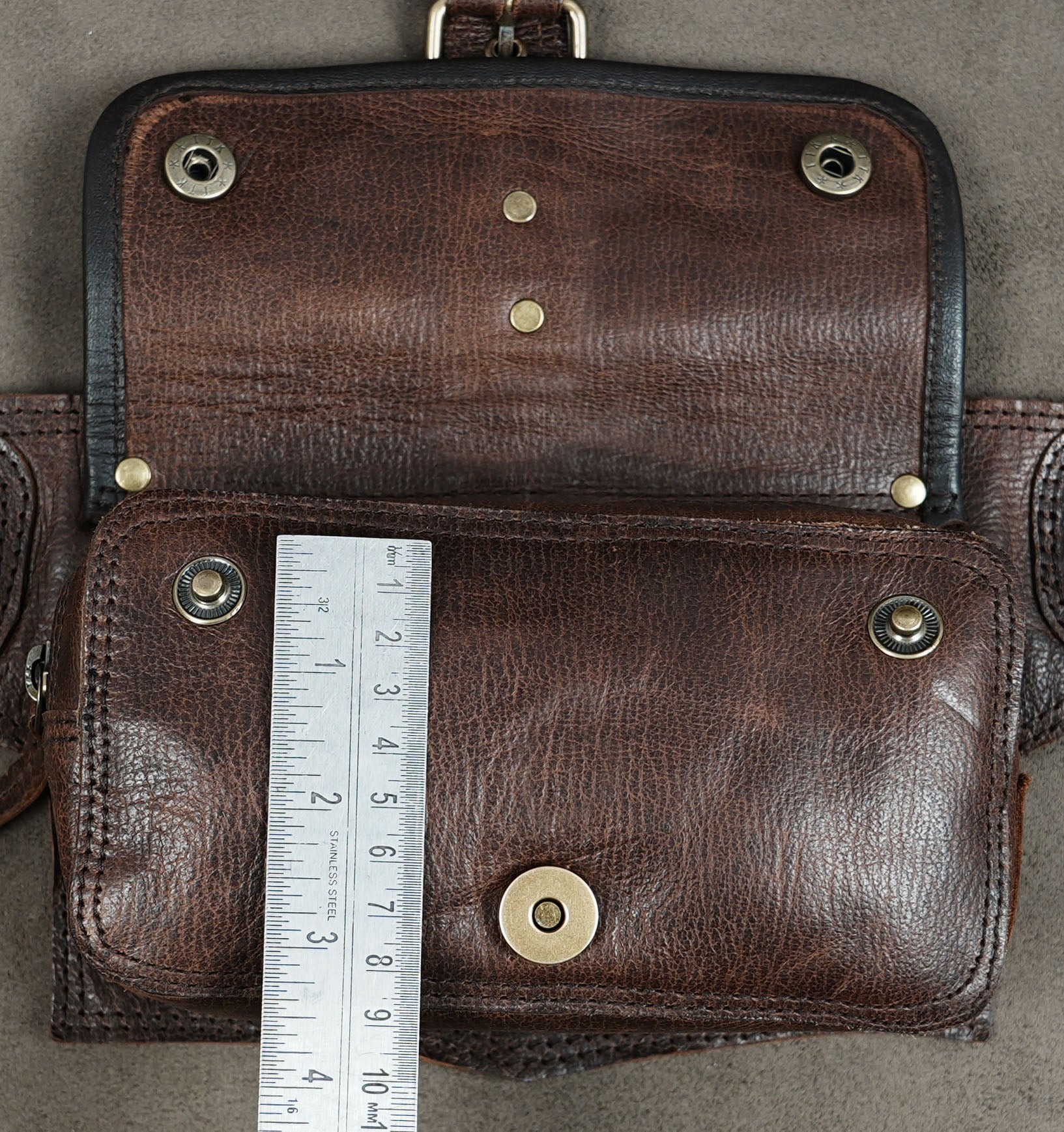 Brown leather festival belt featuring antique brass hardware