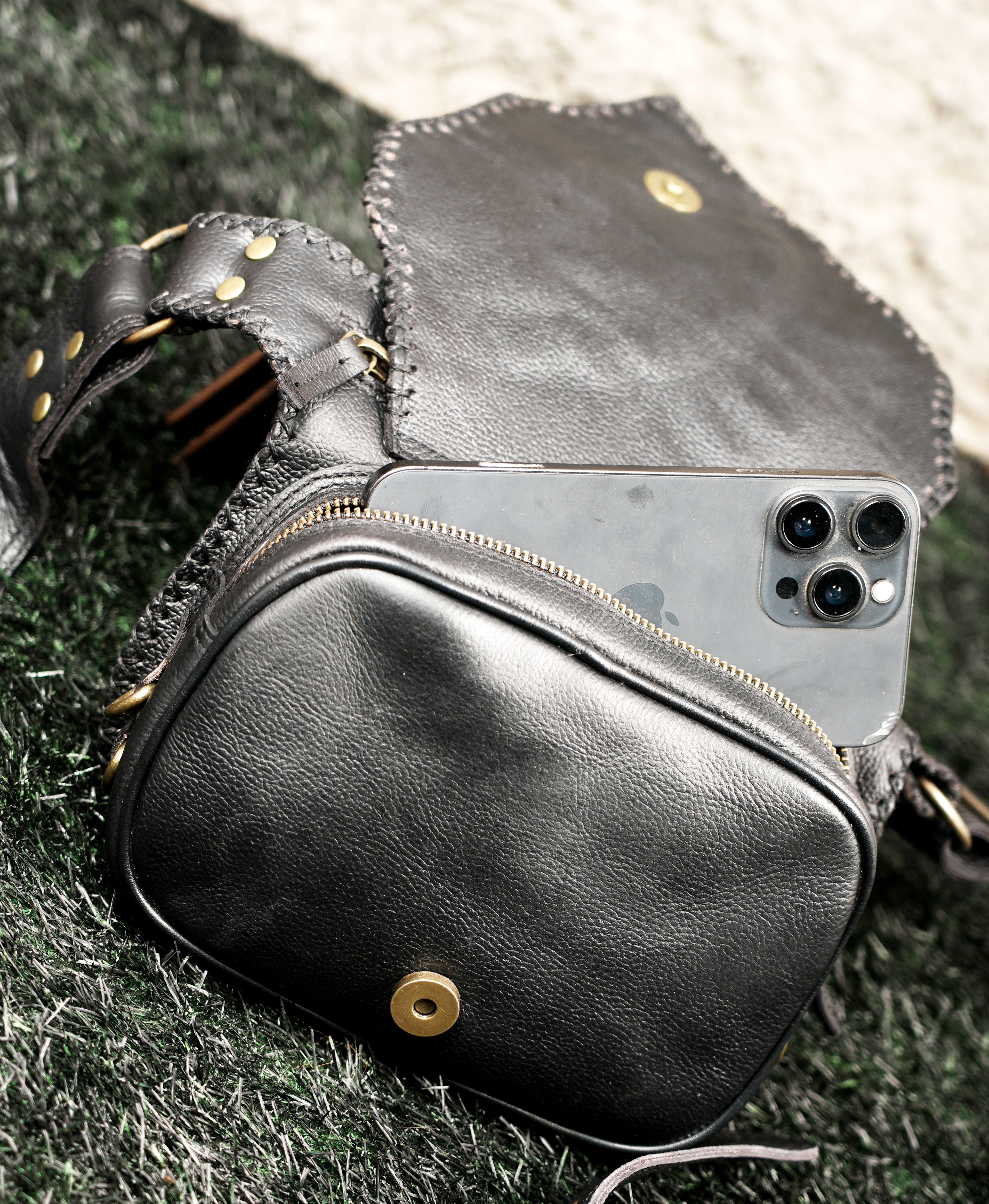Handmade leather utility waist pouch with metal stud accents