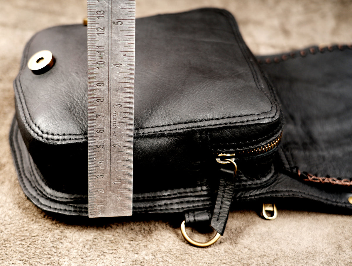 Handmade black leather harness bag with dual front pouches