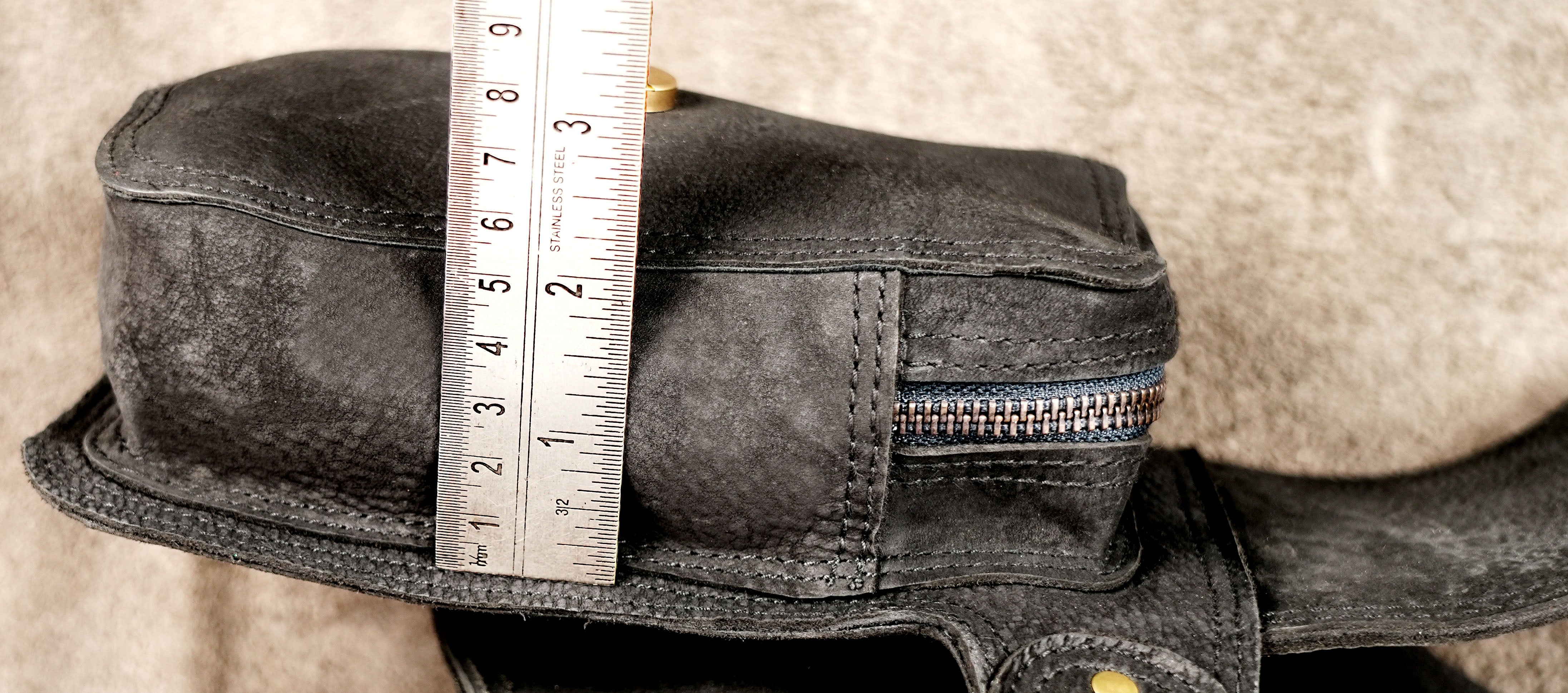 Leather waist pack belt with multiple pockets and brass details