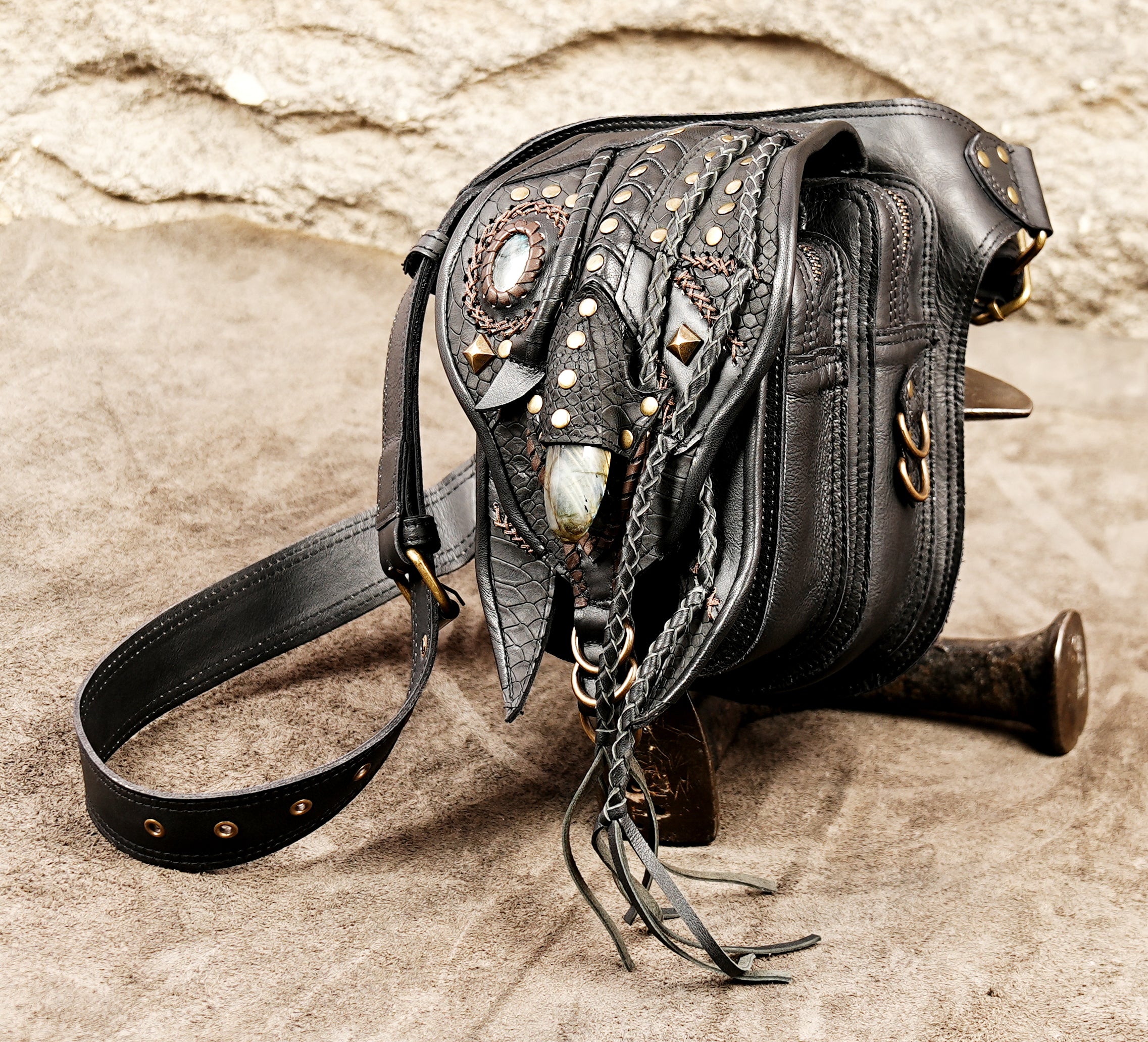Ergonomic leather motorcycle hip bag with adjustable waist strap and brass accents.