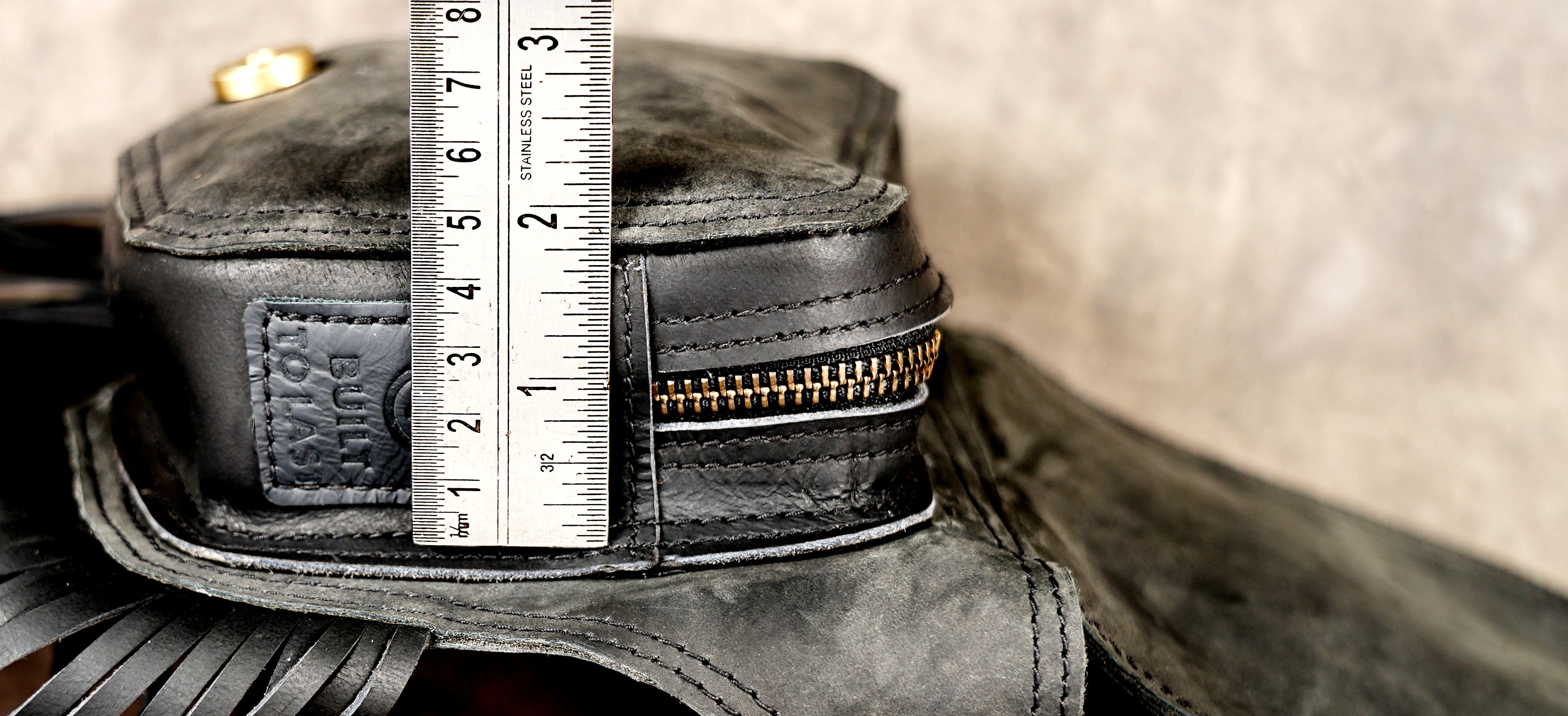 Black leather utility belt pouch with gemstone detail and antique brass hardware.