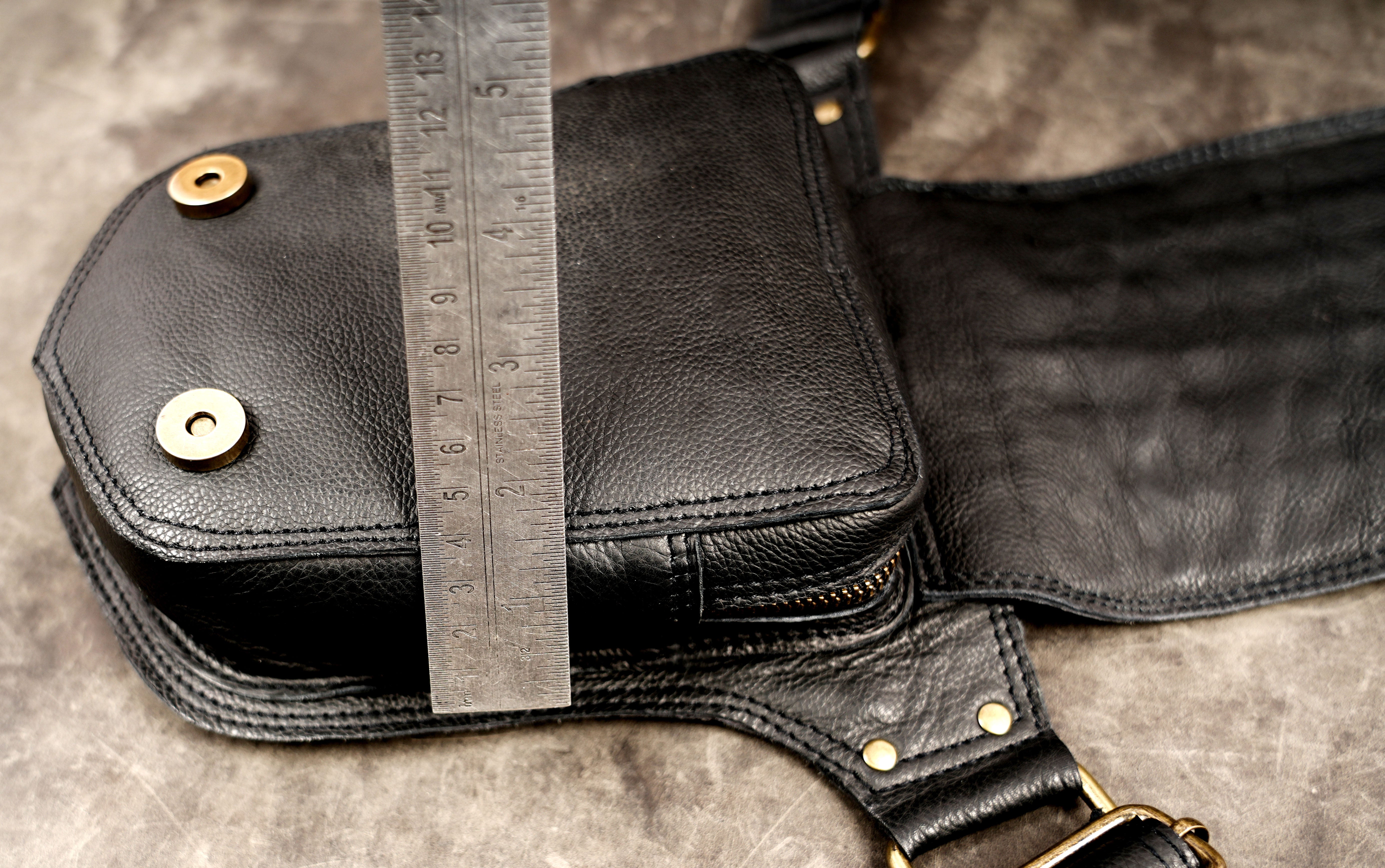 Black leather decorative hip belt with brass buckles