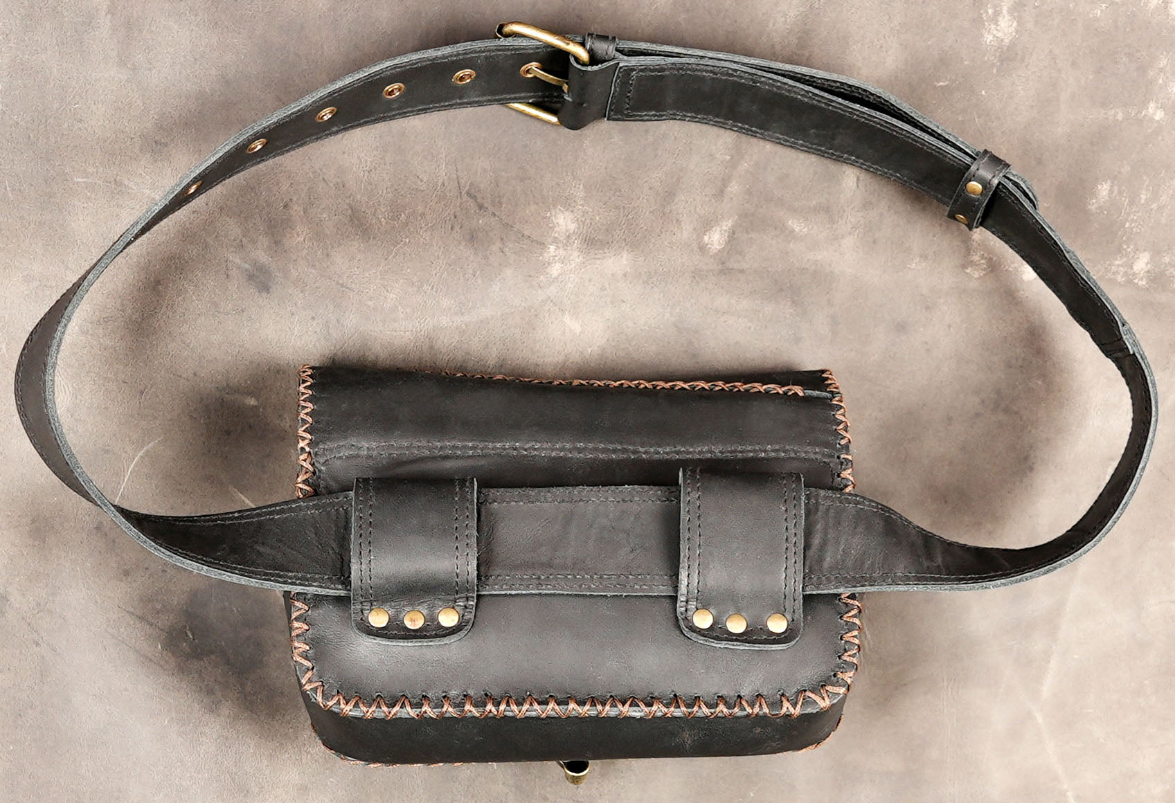 Unisex black leather hip bag with adjustable strap