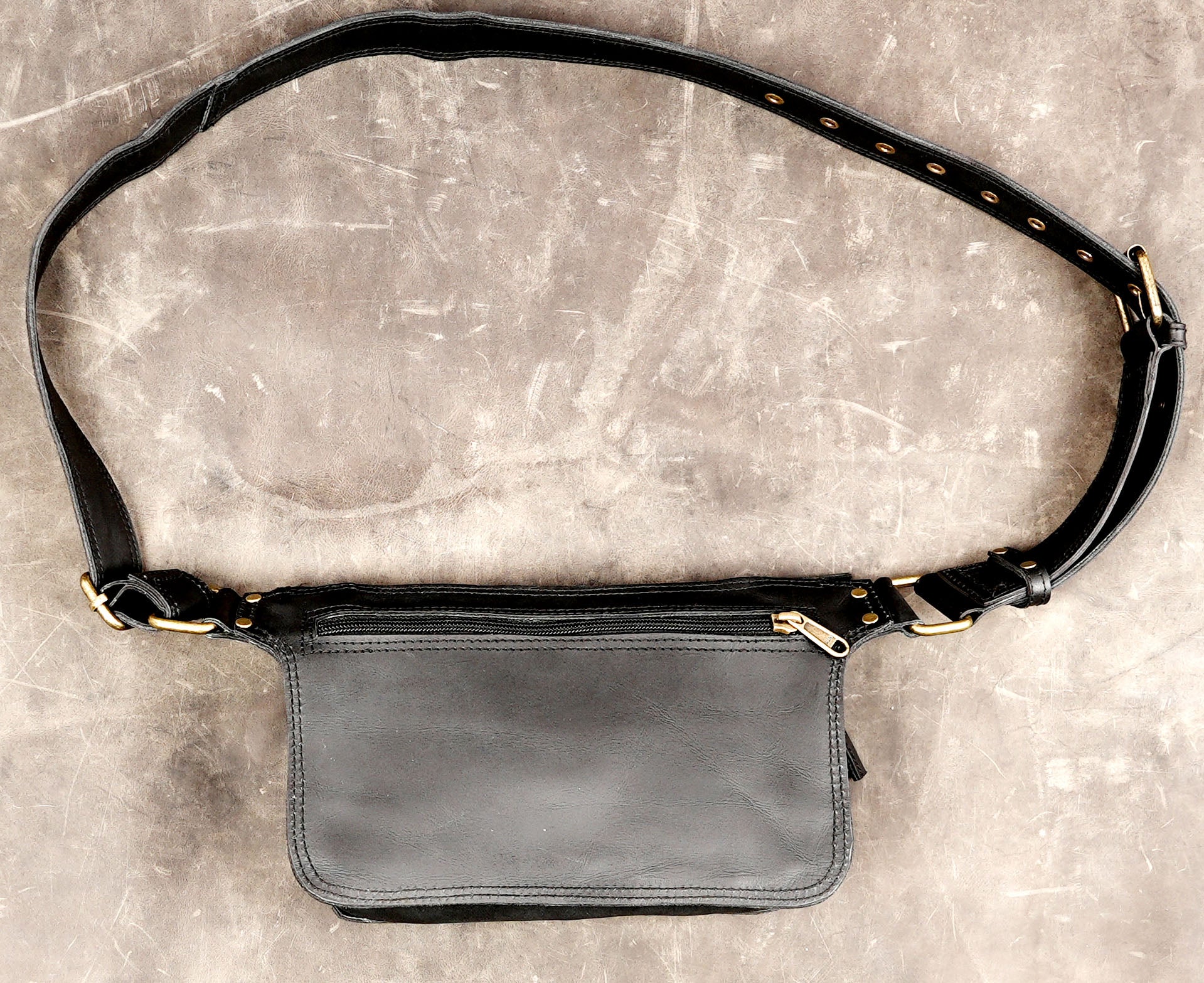 Black leather waist pack with multiple practical pockets