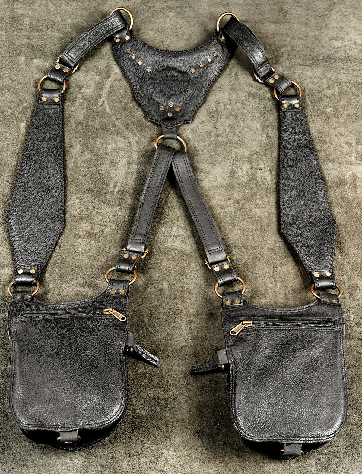 High-fashion leather body harness featuring symmetrical holster bags for an urban explorer aesthetic