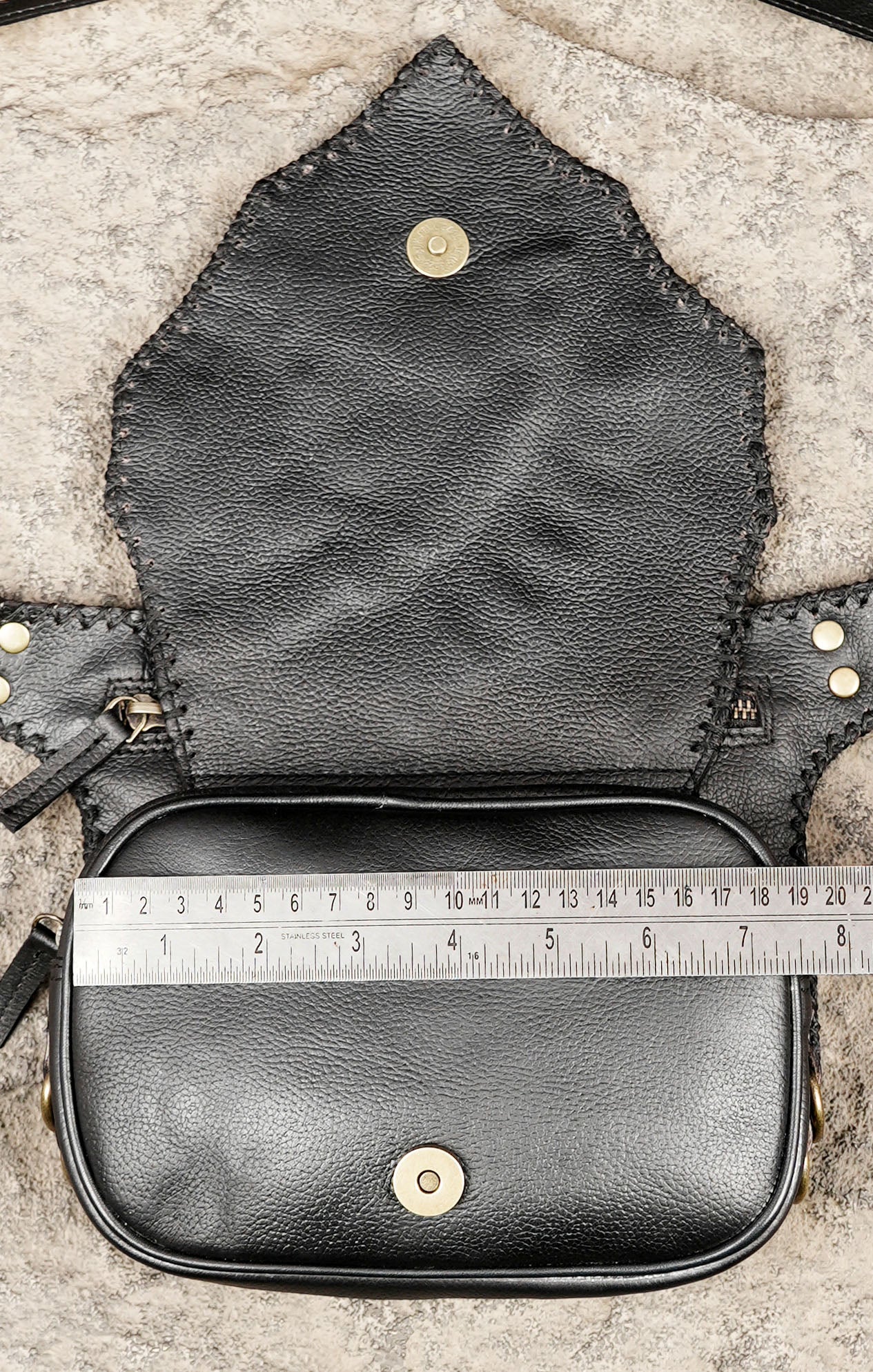 Handmade leather waist bag with decorative stone centerpiece