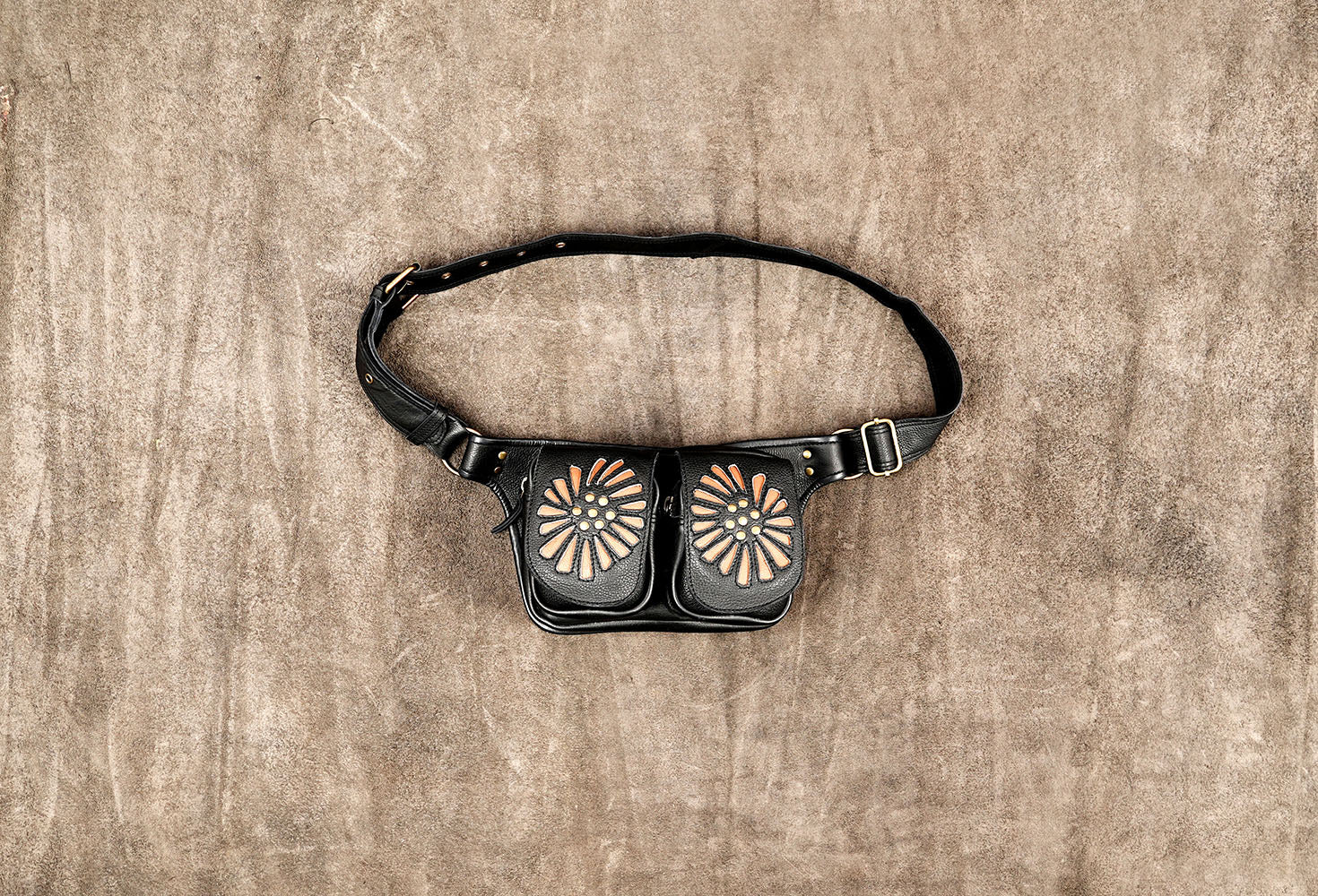 Handmade black leather hip bag featuring two practical front pouches and an adjustable belt.