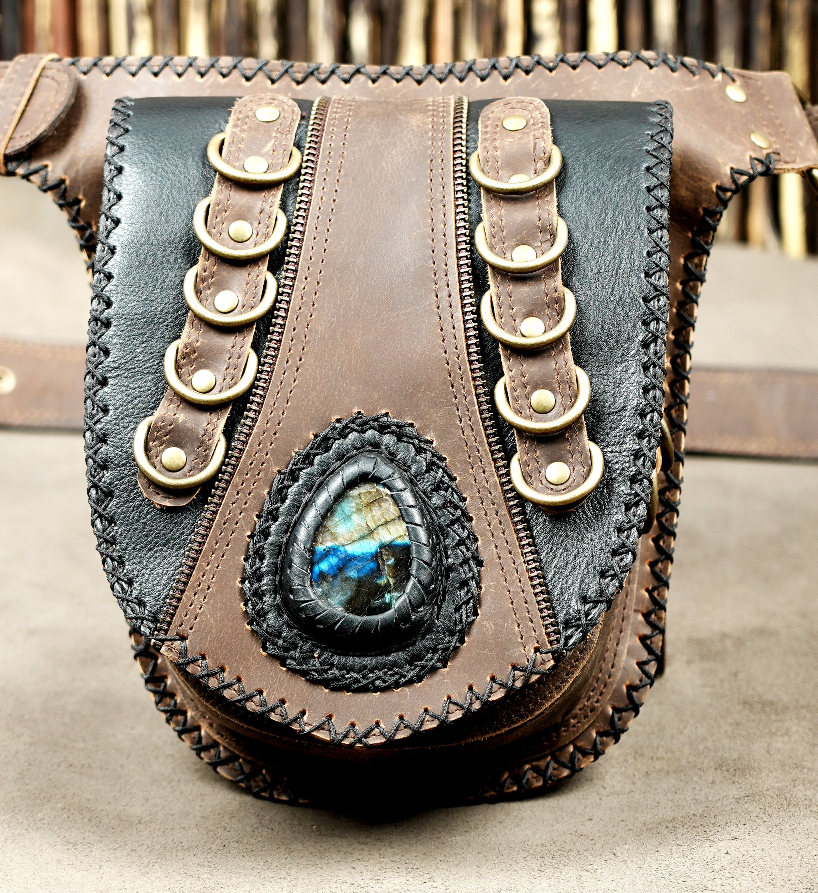 Genuine leather waist pouch with secure zipper pockets and adjustable belt.