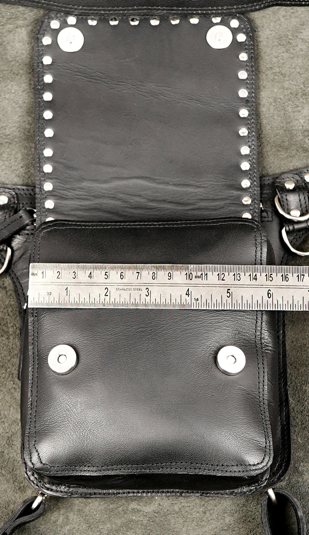 Grunge aesthetic black leather thigh holster pack with adjustable belt.