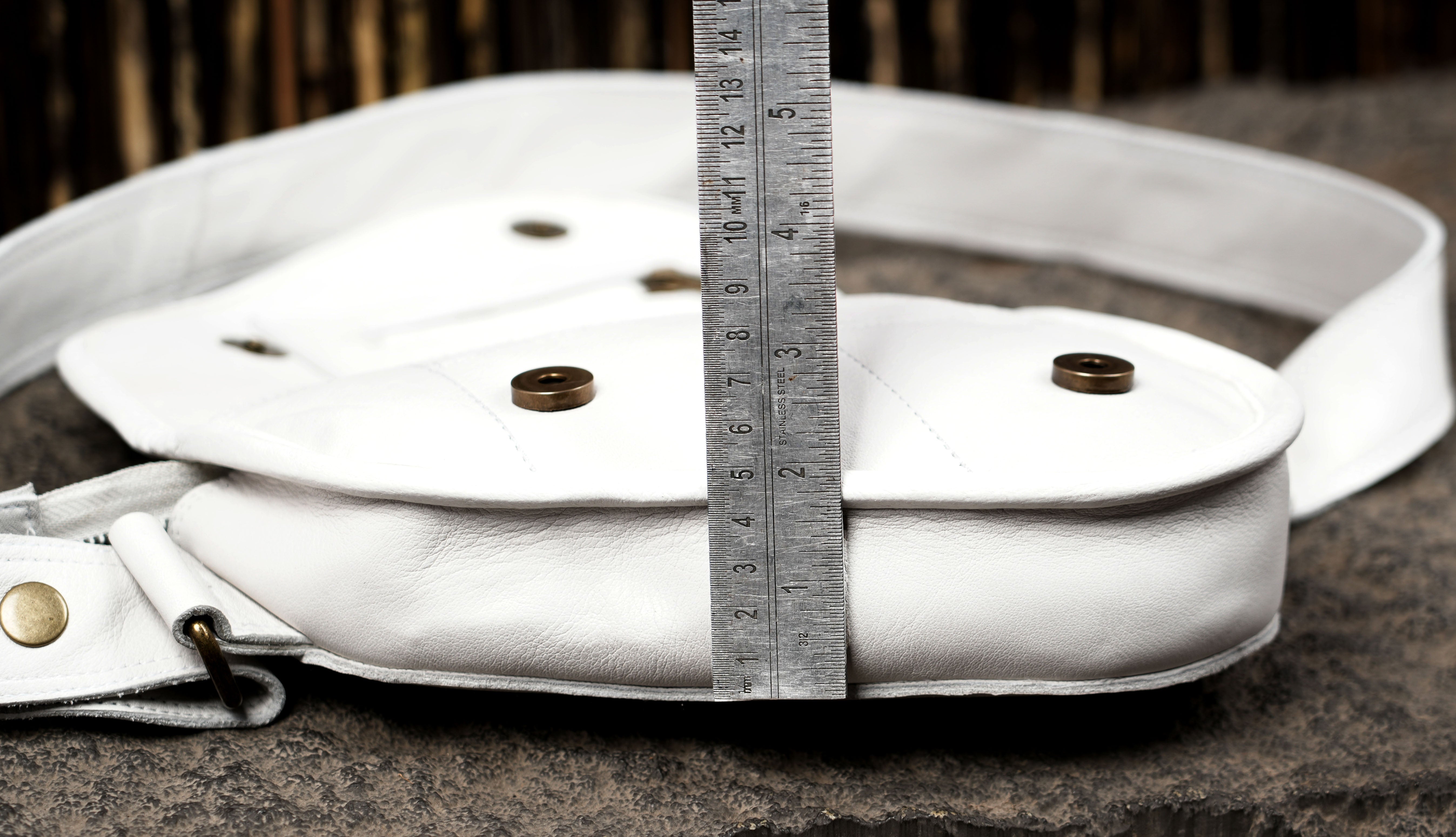Handmade white leather saddle bag with natural stone detail