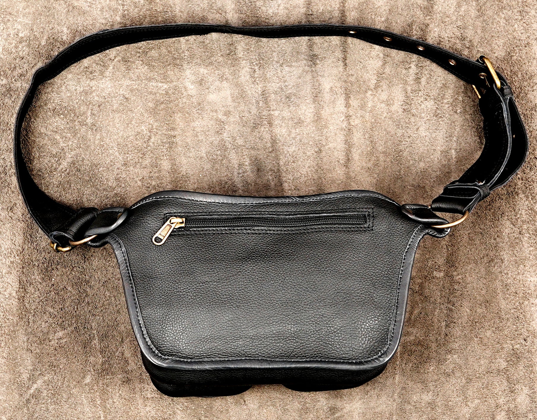 Genuine leather festival waist bag with double pouches and handmade floral detailing.