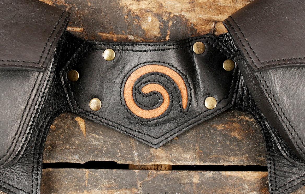 Gothic boho black leather pocket belt with side lacing and metallic brass hardware.