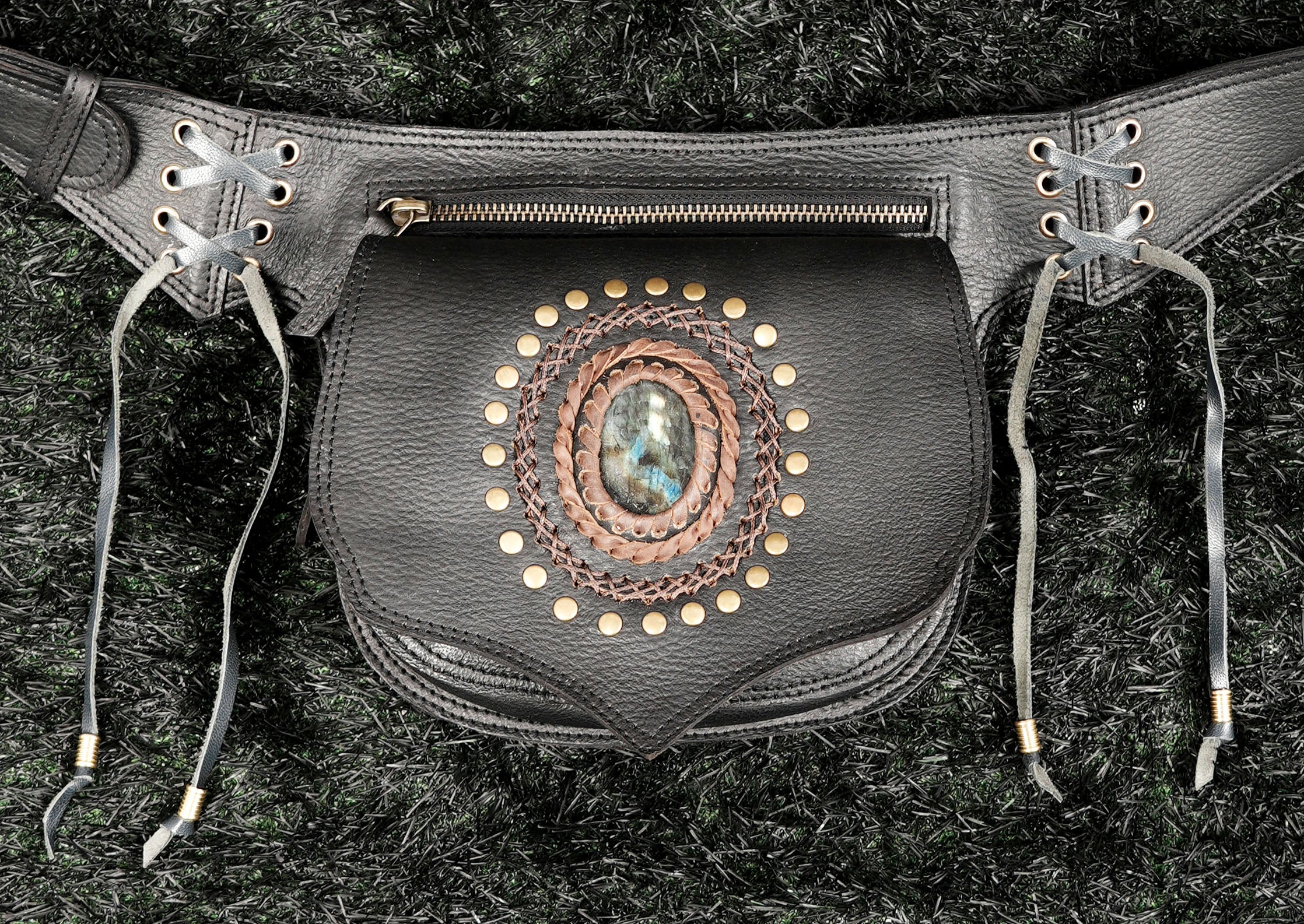 Genuine black leather festival belt bag featuring natural gemstone and lace-up side details.