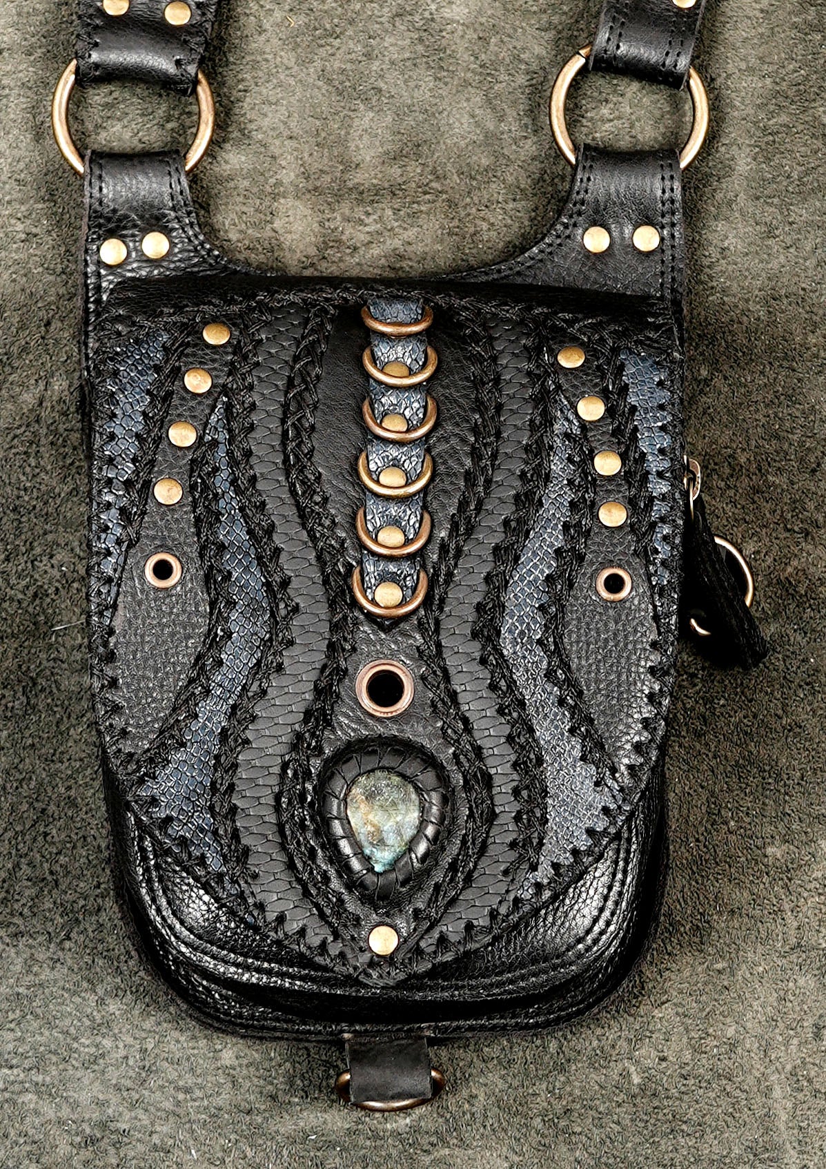 Genuine leather double holster chest bag featuring intricate tooling and twin front compartments for urban and rave outfits