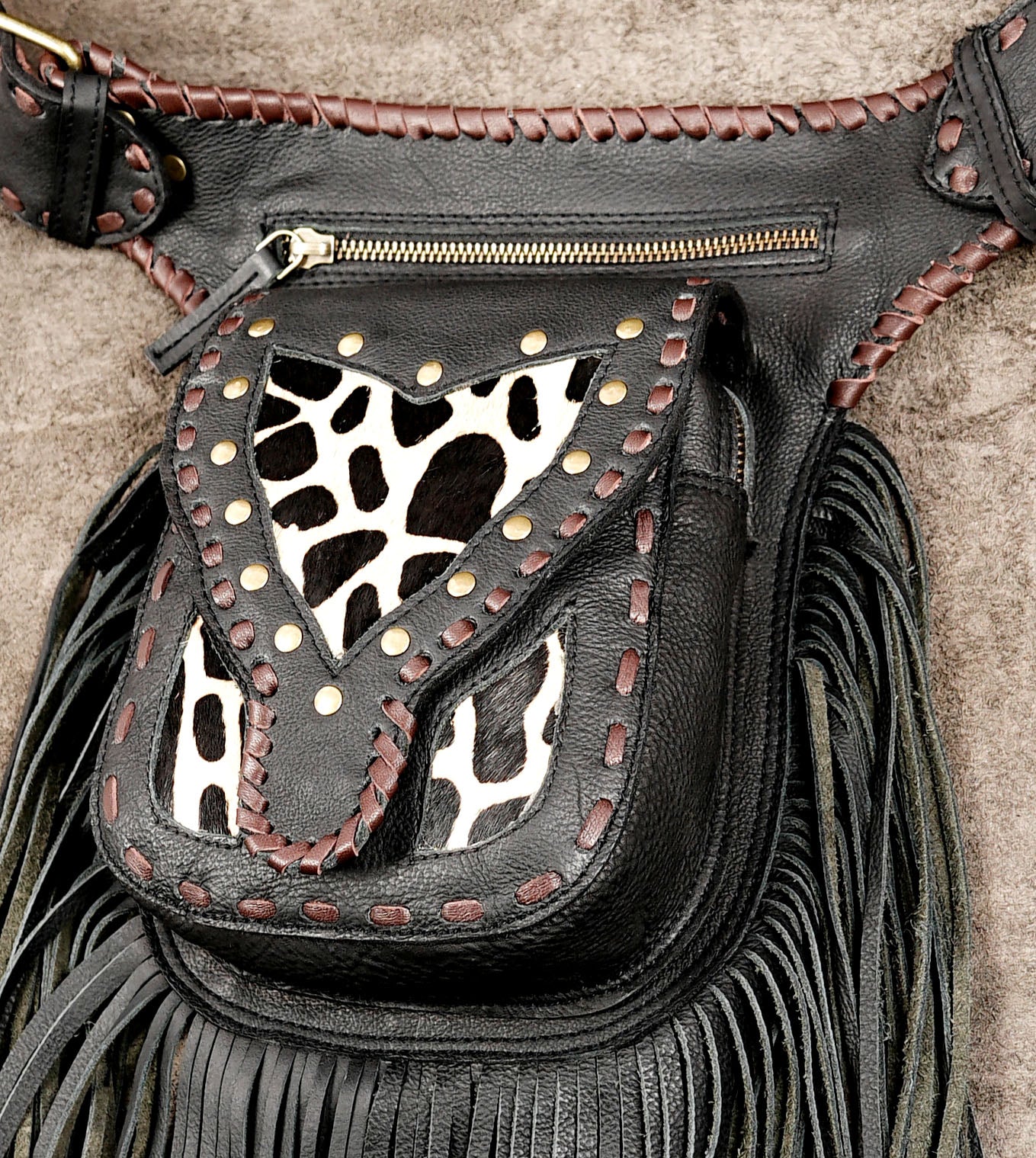 Black Leather Fringe Waist Belt Bag with Cow Print Detail and Antique Brass Hardware