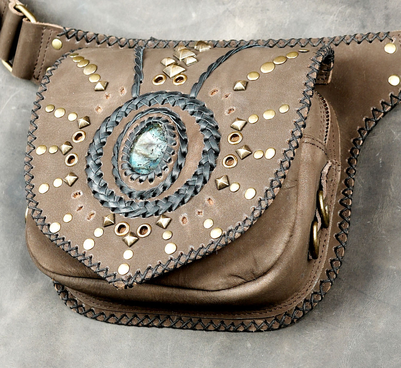 Adjustable leather hip pouch with tribal stud design