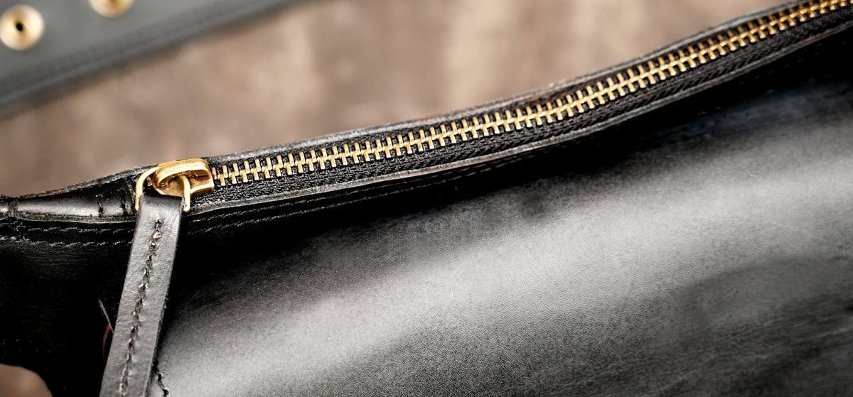 Leather waist pouch with adjustable strap and front pocket