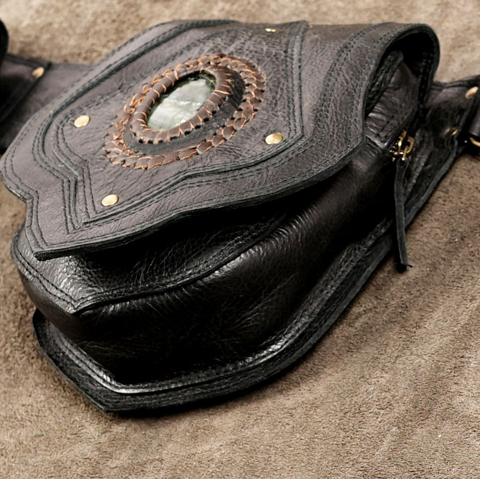 Handcrafted leather utility belt with whipstitch trim