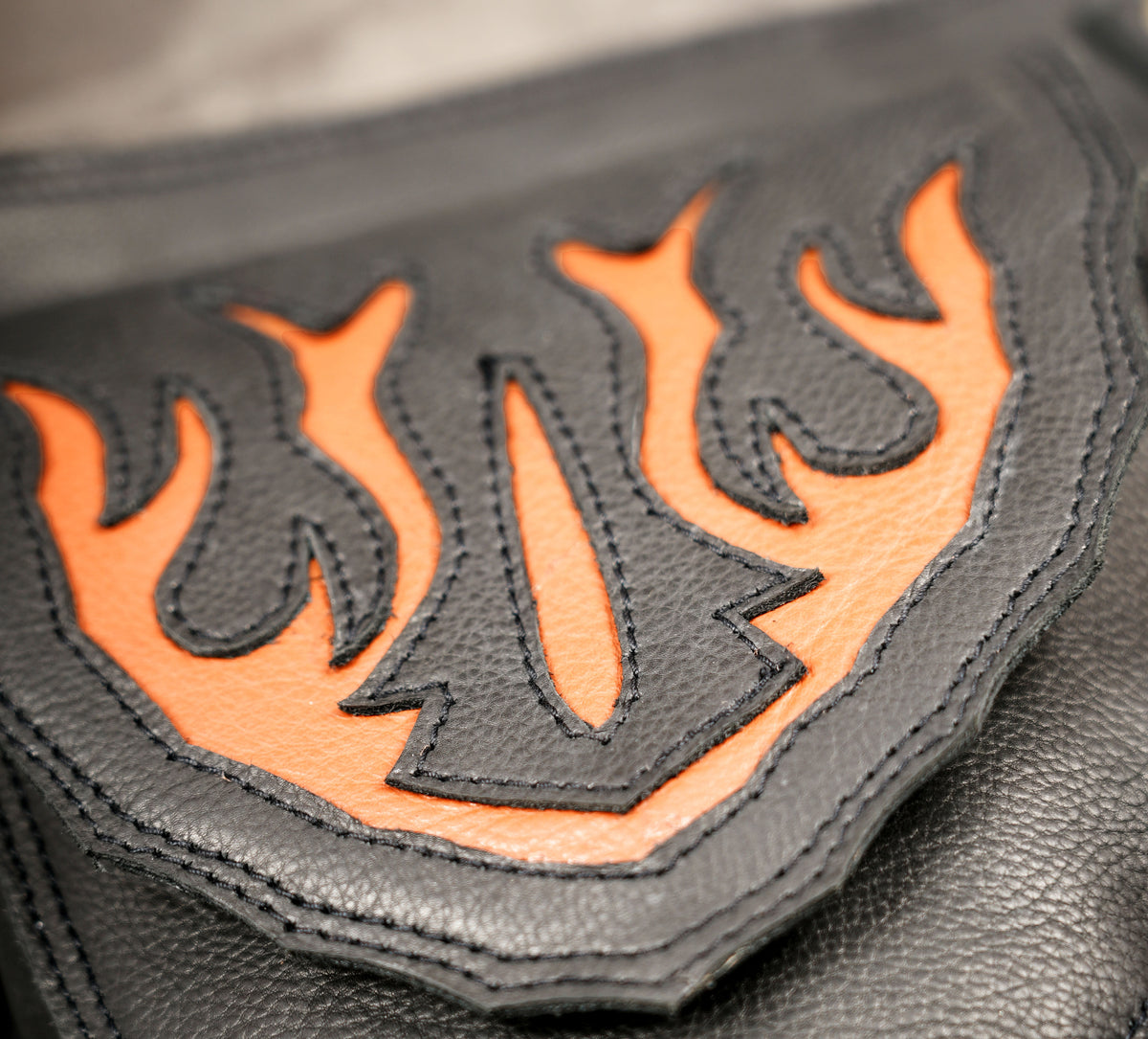 Black leather hip pouch with orange leather detail