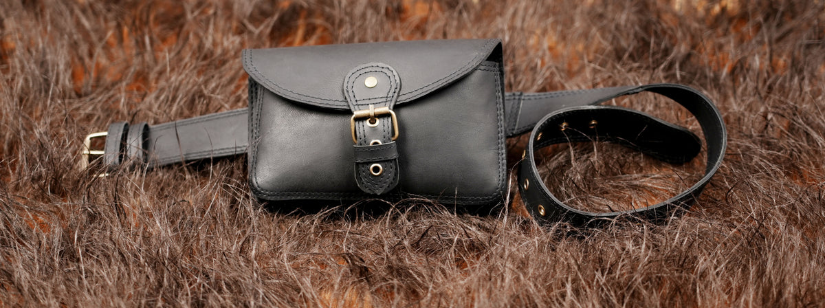 Boho black leather belt bag with double stitched buckle strap