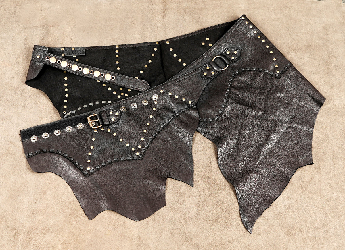 Leather Burning Man outfit skirt with asymmetrical panels and studded accents