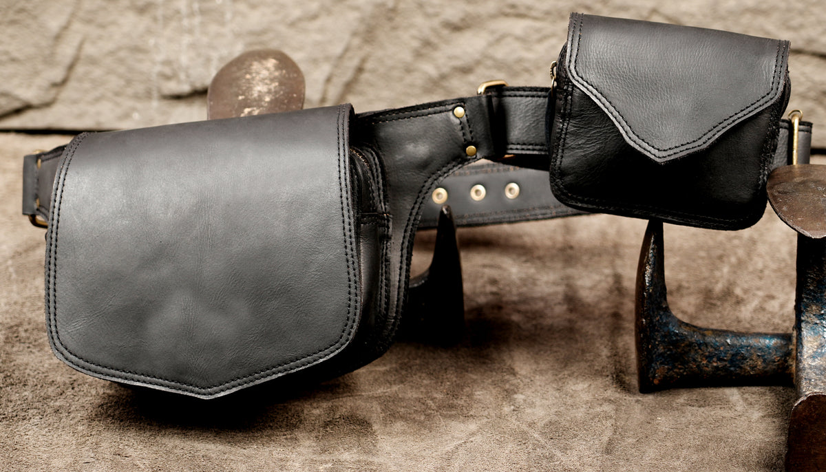 Edgy black leather utility belt with brass-toned hardware   