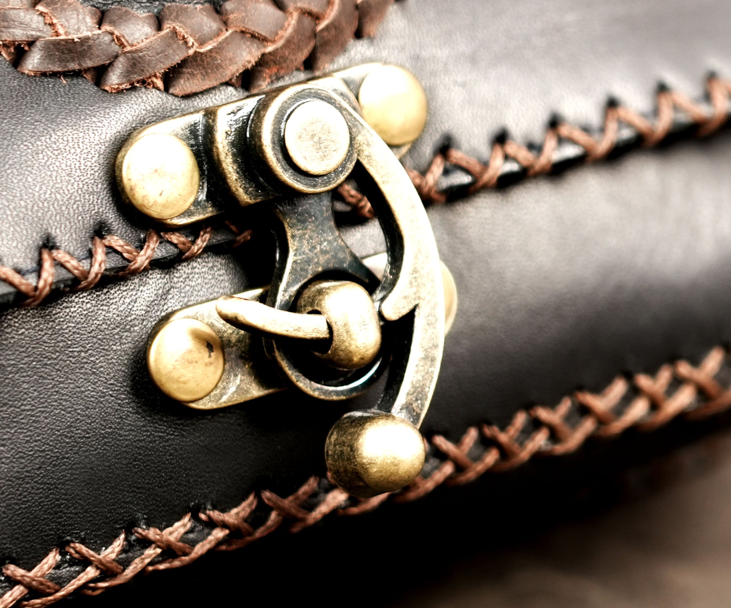 Adjustable black leather bum bag with secure clasp