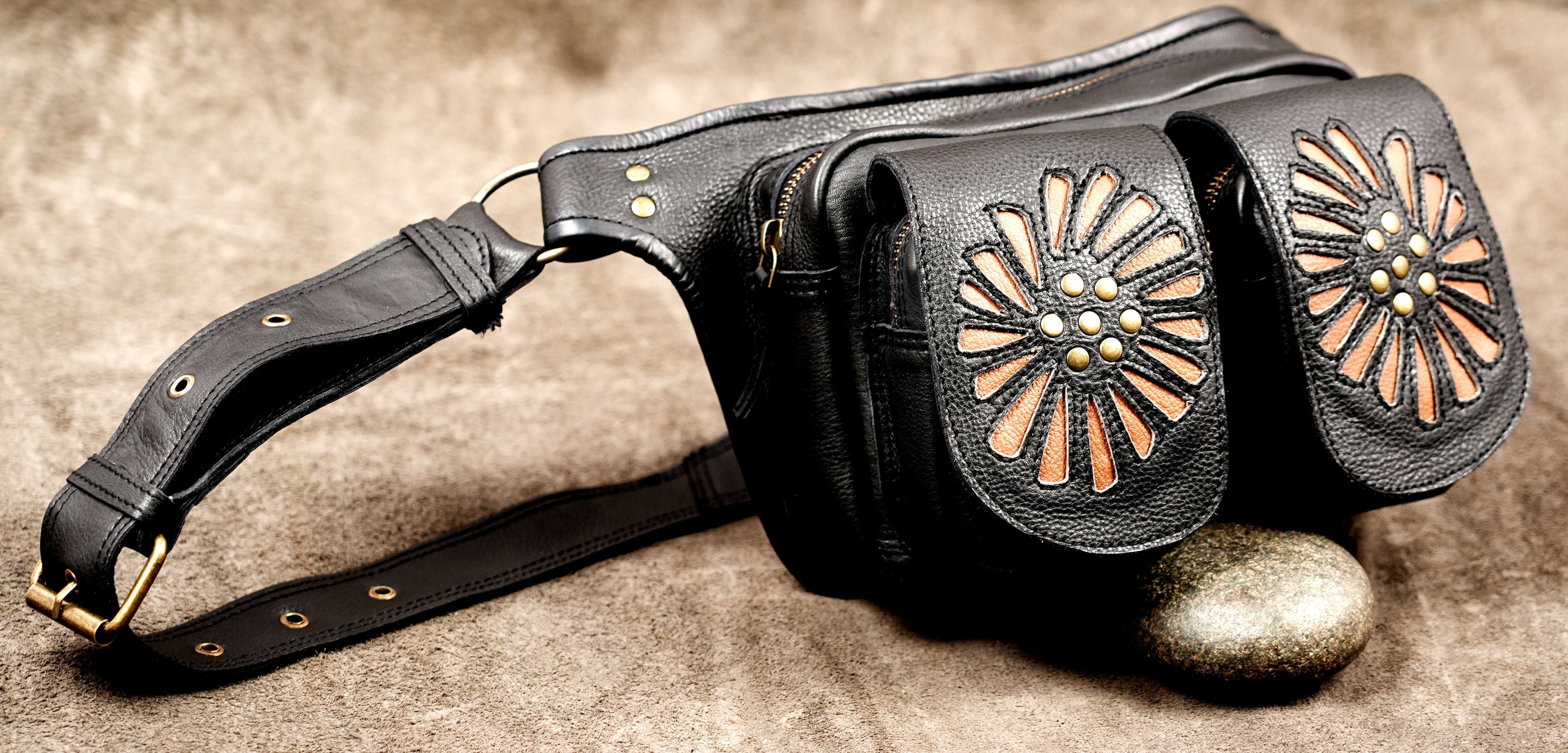 Bohemian black leather hip pouch featuring a double-pocket design and floral decoration.